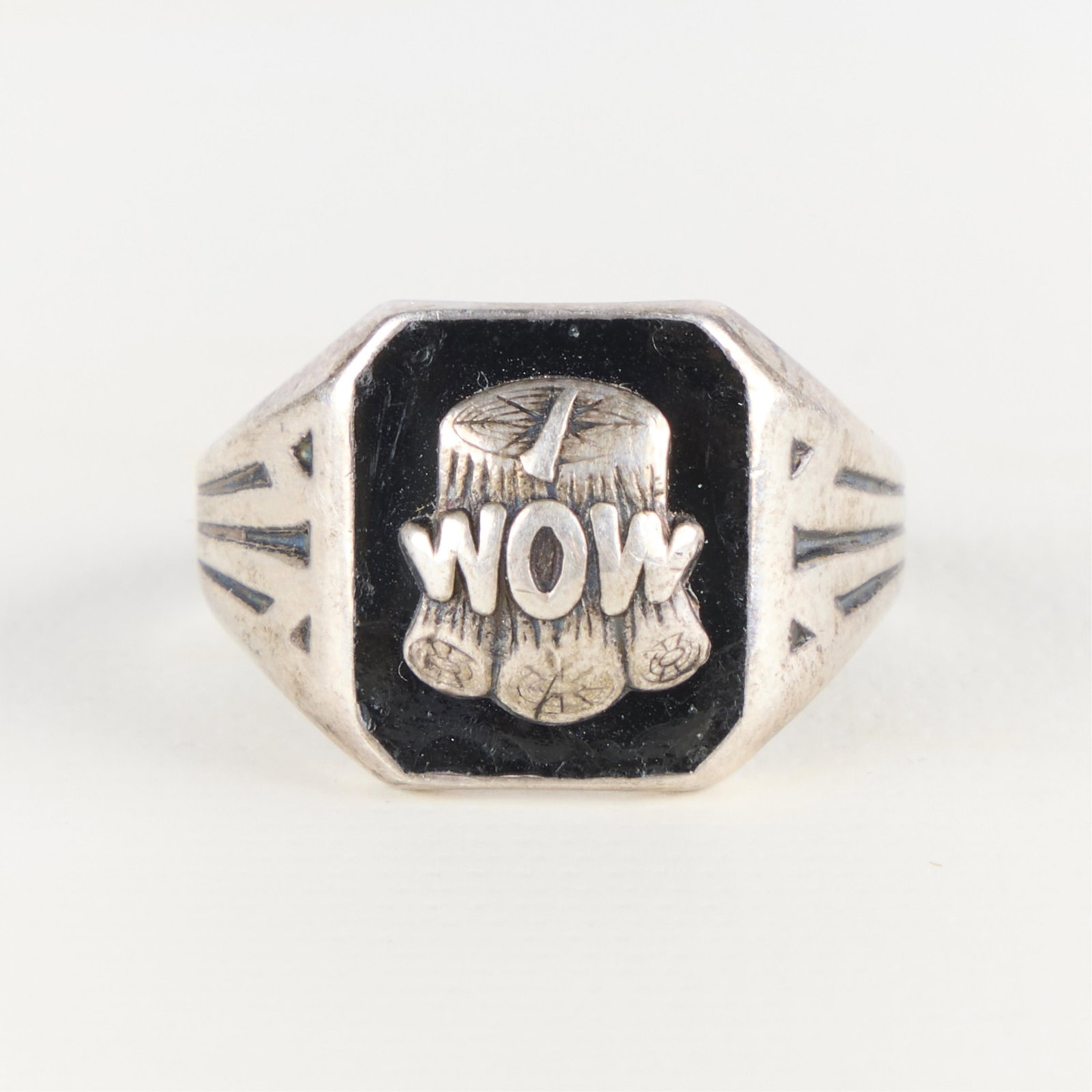 Vintage Sterling Woodmen of the World Signet Ring: Vintage sterling silver "Woodmen of the World" fraternal signet ring with stylized "WOW" emblem. Marked along the band. Ring size: 10 1/4 US. Weight: 8.02 g.