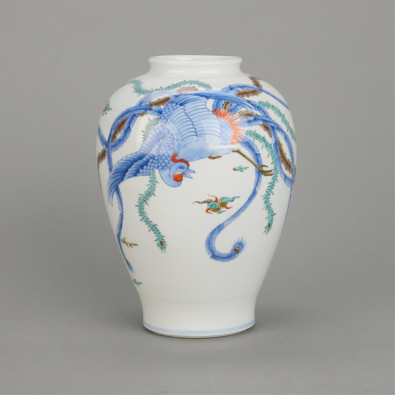 Chinese Porcelain Phoenix Vase: Chinese porcelain base of baluster form depicting a phoenix. With blue underglaze mark and iron-red mark along the underside. Height: 10 1/2 in x diameter: 7 in.