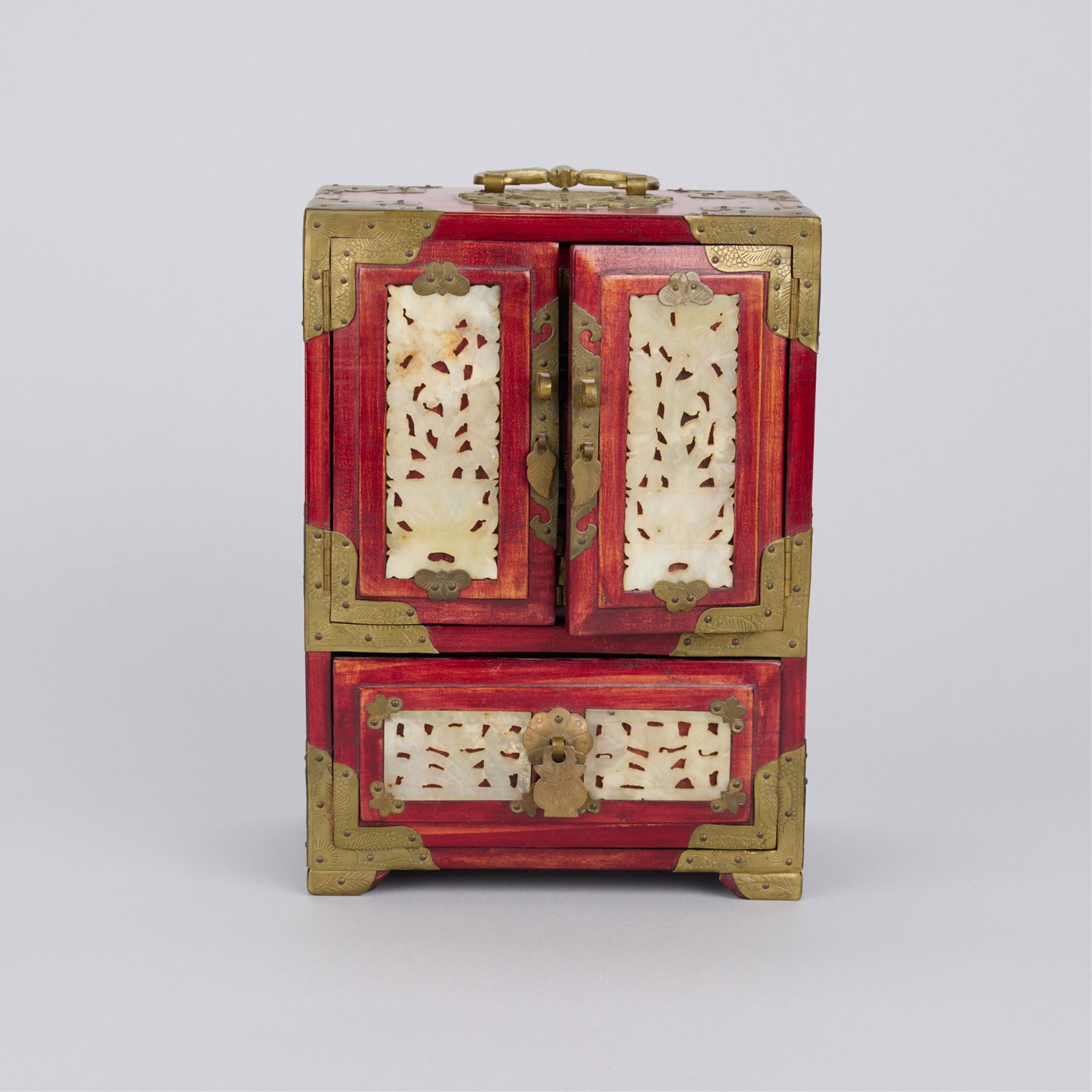 Chinese Teak Jewelry Box w/ Inset Pierced Jade: Chinese teak jewelry box with inset pierced jade panels and brass hardware. Height: 9 1/2 in x width: 7 in x depth: 4 3/4 in.