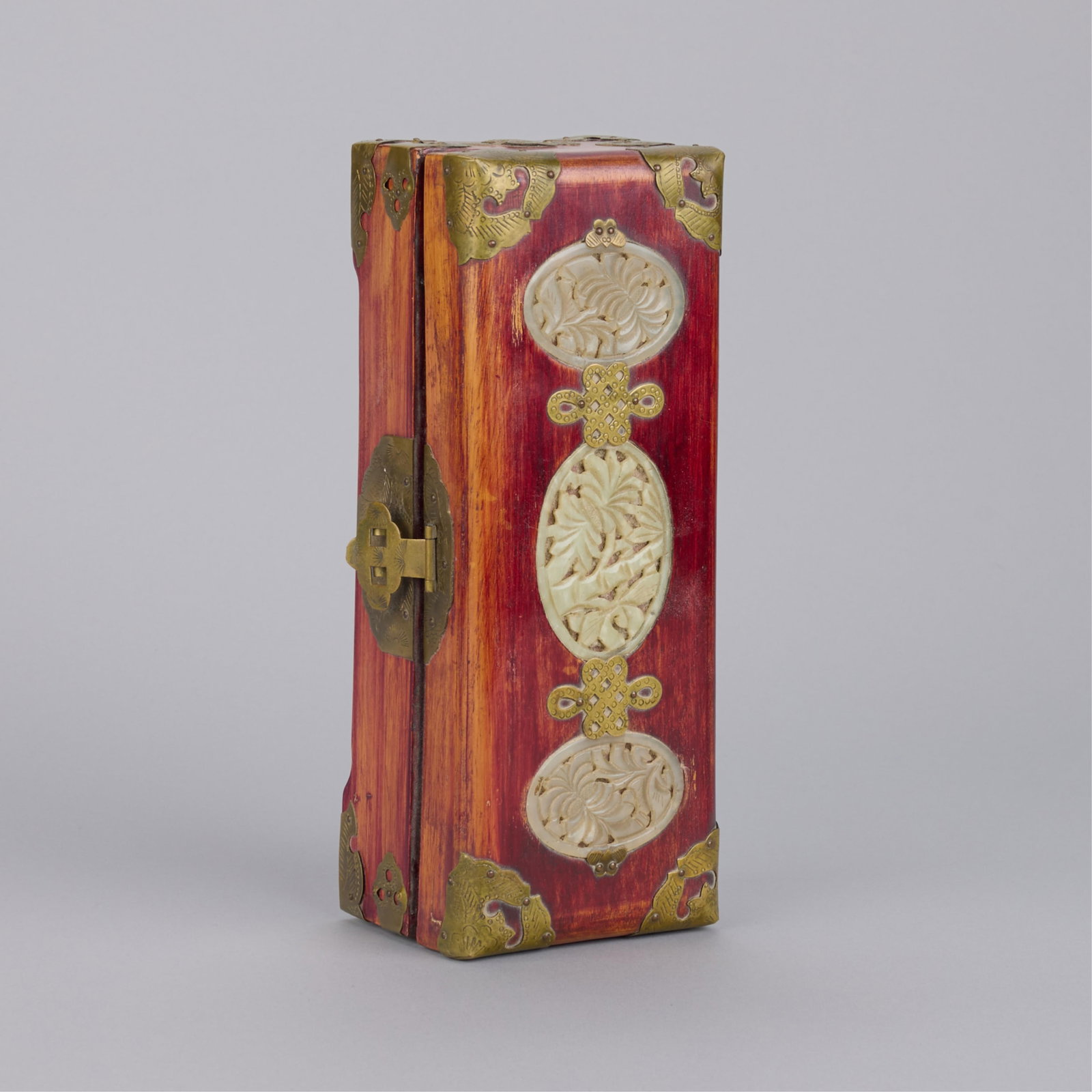 Chinese Teak Jewelry Box w/ Inset Pierced Jade: Chinese teak jewelry box with inset pierced jade panels and brass hardware. Green silk interior. Height: 3 in x width: 10 in x depth: 3 1/2 in.