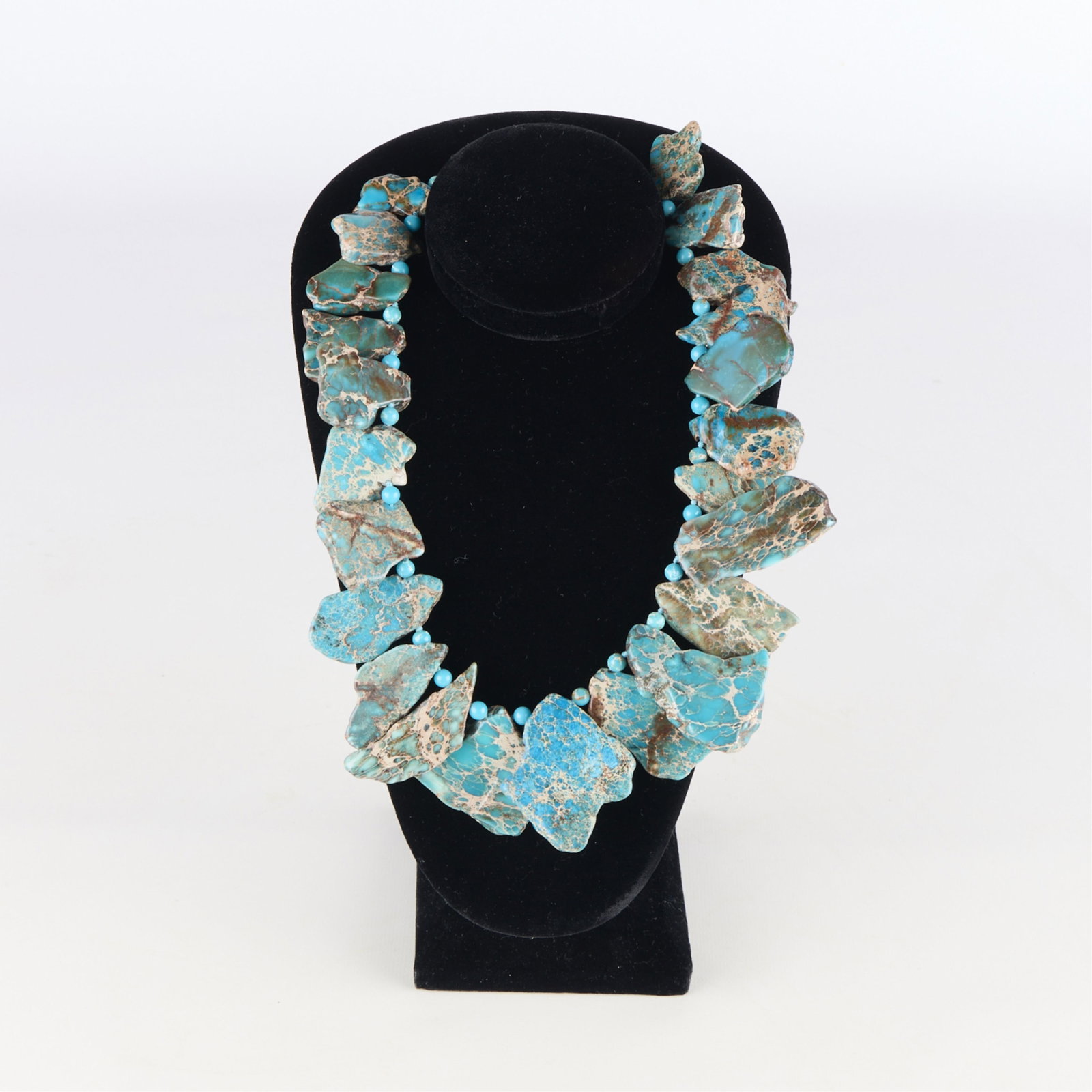 Turquoise Stone Slab Necklace w/ Sterling Clasp: Necklace featuring turquoise stone slabs of varying sizes. With a sterling clasp marked 925, "LUC," and "CN." Length: 20 in.