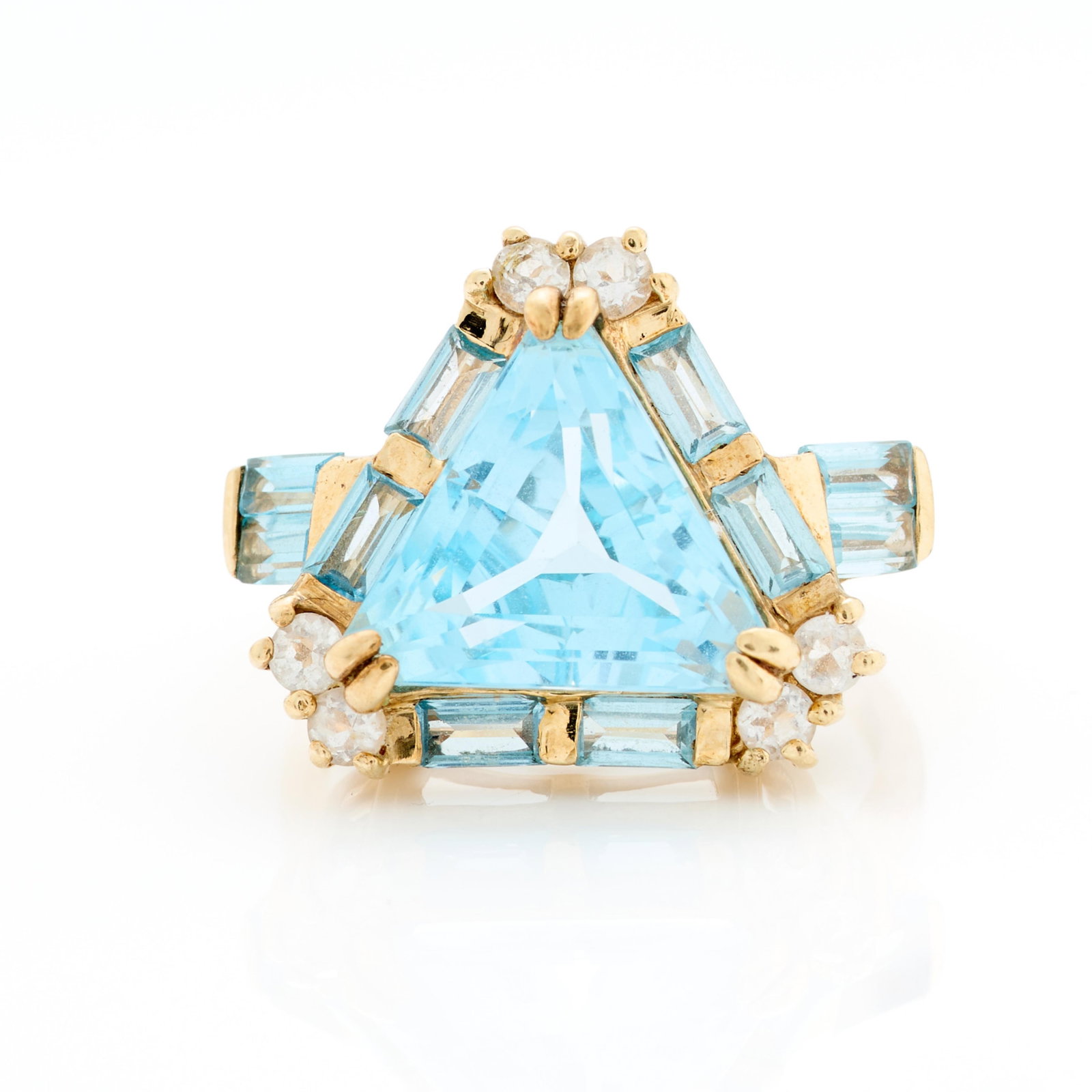 10k Yellow Gold Blue Topaz Ring Sz 8.25: 10k yellow gold ring set with trillion cut blue topaz accented with topaz baguettes and imitation diamonds. Marked 10k along the interior shank. Ring size: 8 1/4 US. Gross weight: 6.33 g