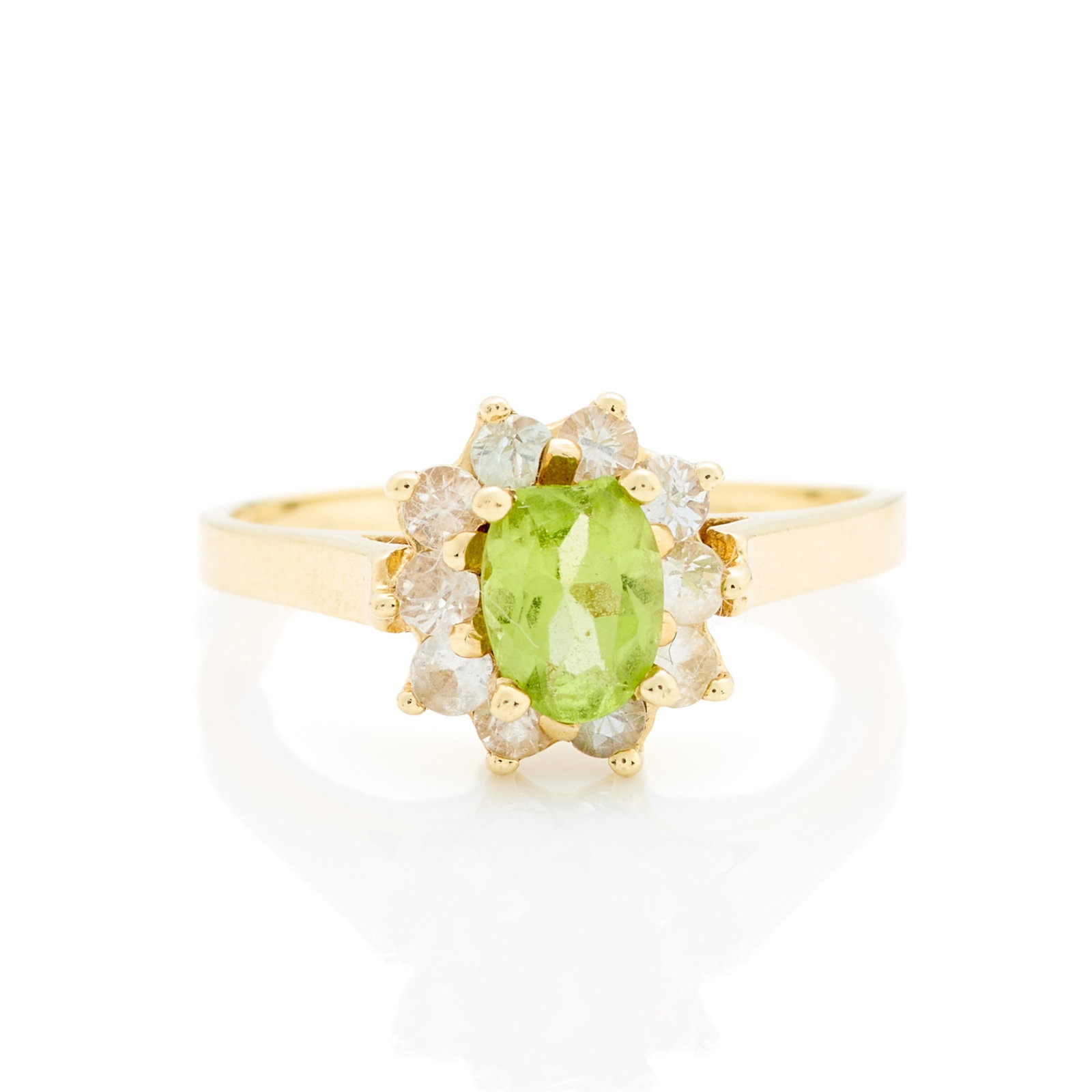 14k Yellow Gold & Peridot Ring Sz 8.25: 14k yellow gold ring set with oval peridot surrounded by a halo of small white sapphires. Marked 14k along the interior shank. Ring size: 8 1/4 US. Gross weight: 2.89 g