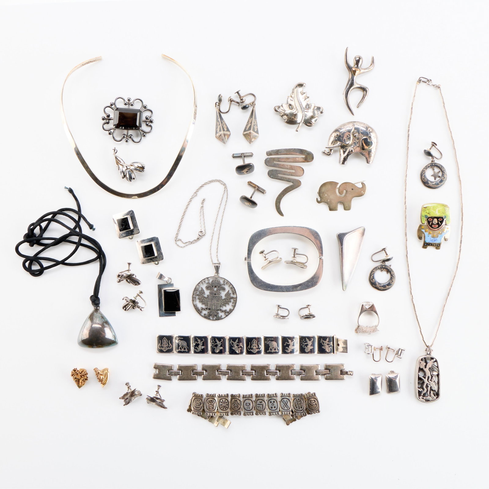 Large Group of Sterling & Silver Jwly: Large group of jewelry marked sterling or silver, including Saimese and Mexican silver. Gross weight: 470.4 g