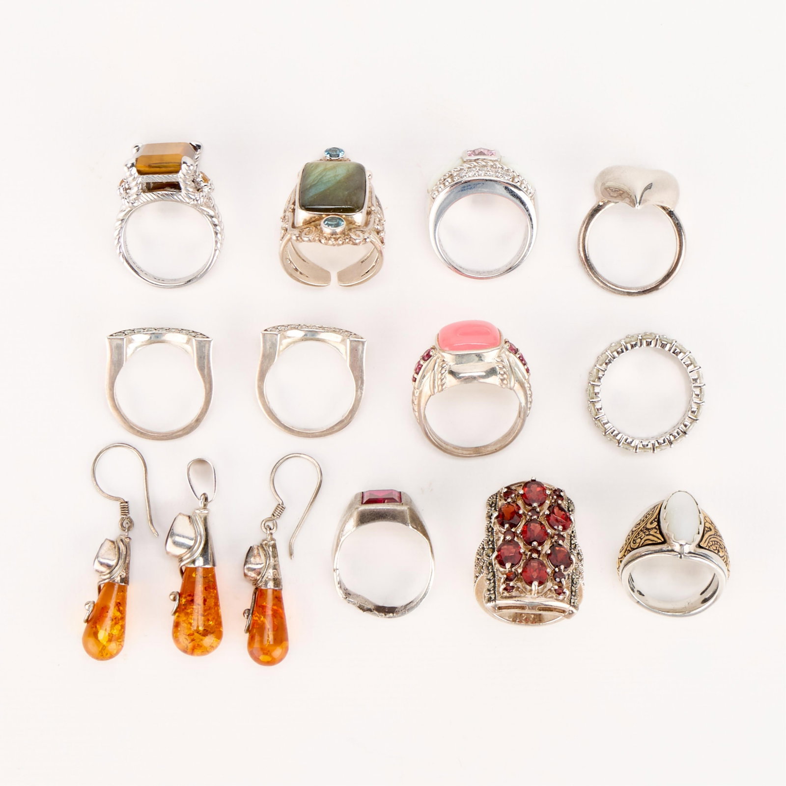 Sterling 925 Jewelry Incl. Thai, Sajen, & Other: Group of 11 sterling 925 costume jewelry rings, one pair of pendant dangle earrings, and one pendant. Marks include: Sajen, Judith Ripka Thailand, Carolyn Pollack, and pieces w/o designer mark. All bu