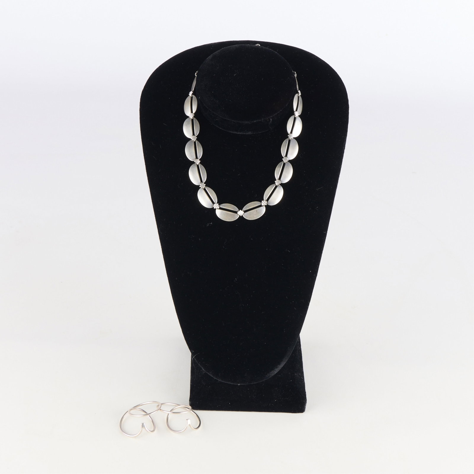 Sterling Necklace & Spiral Earrings: Group of modernist sterling earrings and necklace. Necklace marked sterling wre. Each of the earrings marked 925 HaH. (Necklace) Length: 17 in. Gross weight: 44.38 g