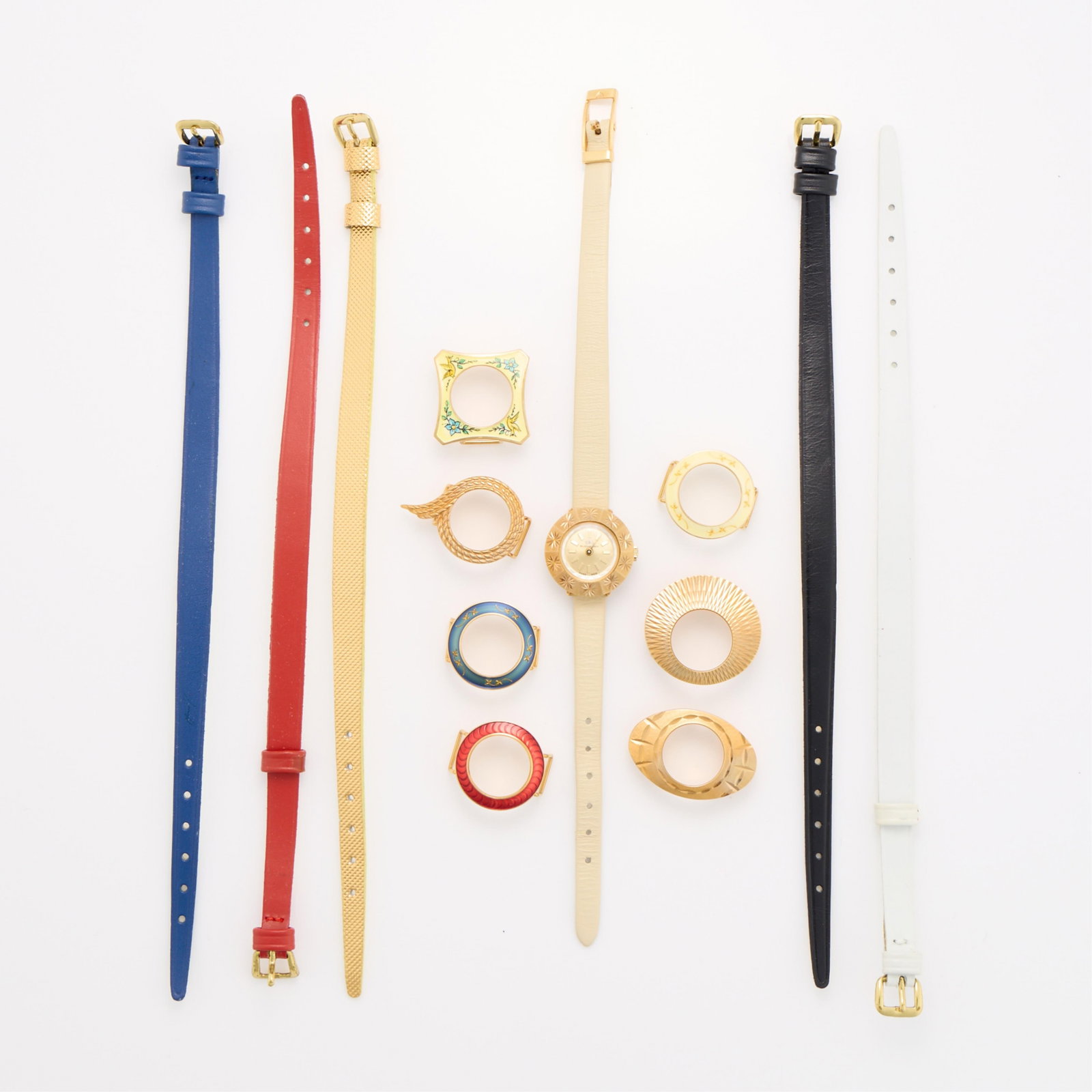 Bucherer Watch w/ Interchangable Bezels & Straps: Bucherer watch with eight interchangable bezels and 6 interchangable straps. With the original box. (Shipping dimensions) Height: 1 in x width: 9 in x depth: 4 in.