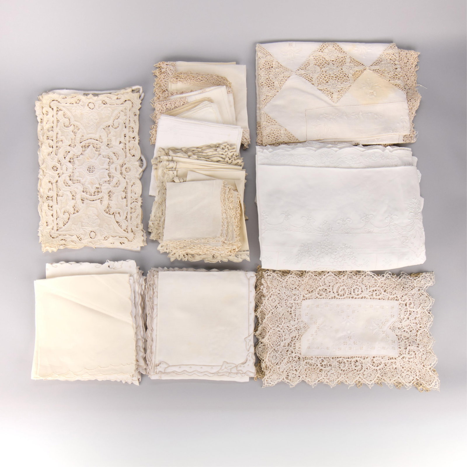 Lrg Group Assorted Linens, Tablecloths, & Doilies: Large group of assorted vintage and antique linens, tablecloths, table mats, napkins, and doilies. Many with lace. (Shipping dimensions) Height: 10 1/2 in x width: 16 in x depth: 14 in.