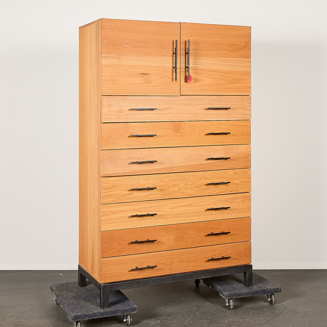 Vintage MCM Wooden 7-Drawer Dresser: Vintage mid-century modern wooden dresser or cabinet featuring seven drawers and two shelves along the interior of the cupboard. With sleek black hardware. Height: 79 1/2 in x width: 47 3/4 in x depth