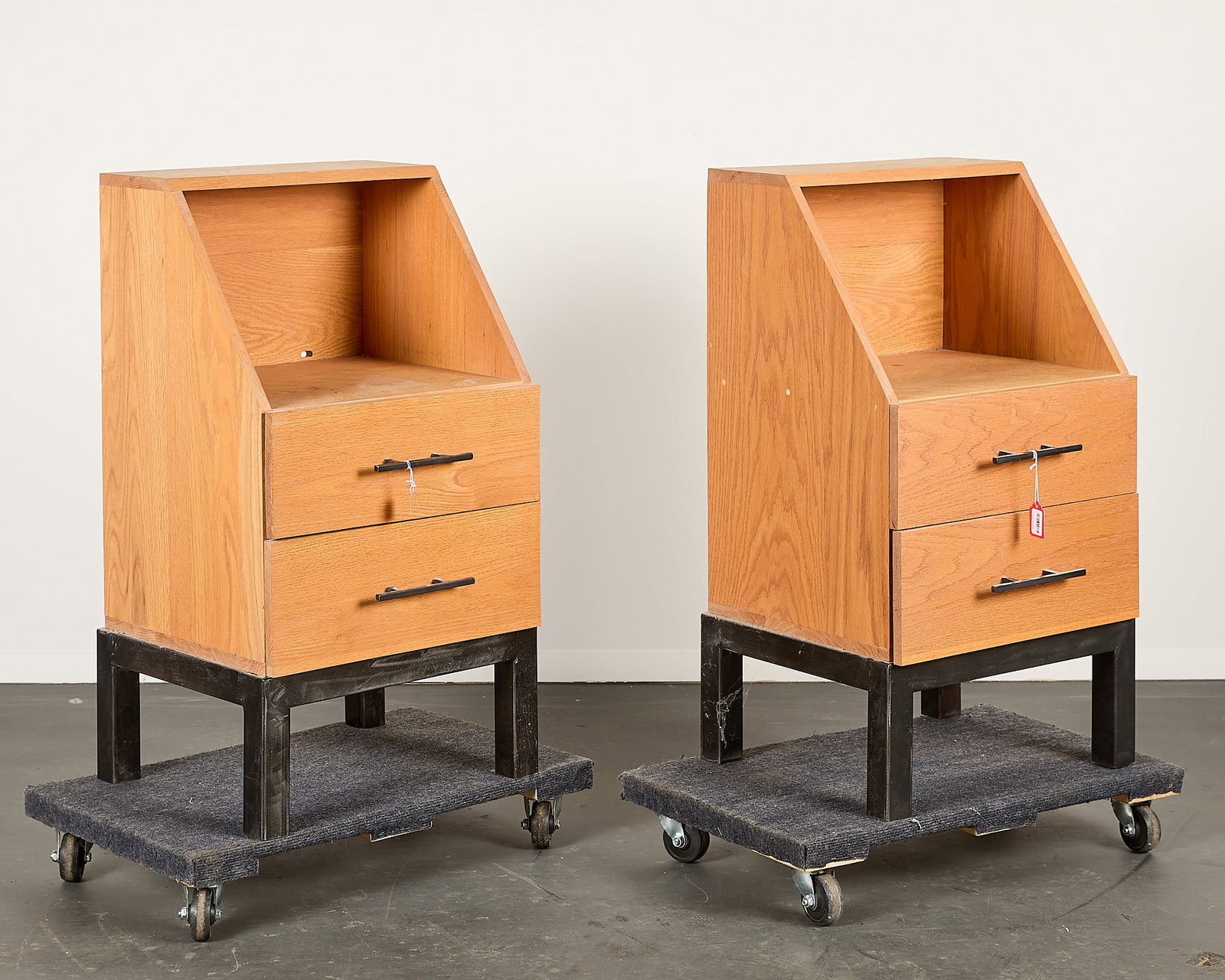 Pair Vintage MCM Wooden 2-Drawer Nightstands: Pair of vintage mid-century modern two-drawer wooden side cabinets, bachelor's chests, night stands, side tables, or secretary desks. Resting on metal frames. With metal pulls. (Each) Height: 37 1/4 i