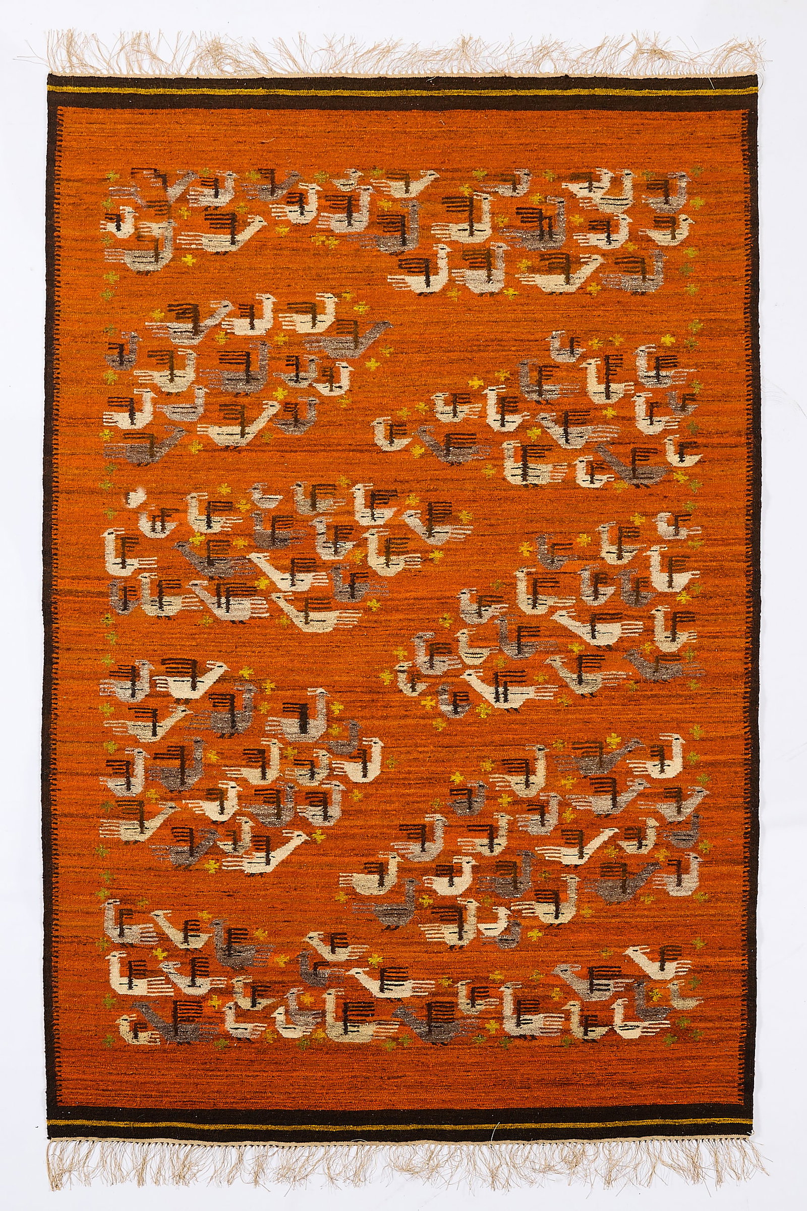 Polish Art Deco Bird Rug 8'1"x5'4": Polish Art Deco tapestry rug depicting stylized birds on burnt orange ground. Executed in grays, black, and yellow. Length: 8 ft 1 in x width: 5 ft 4 in.