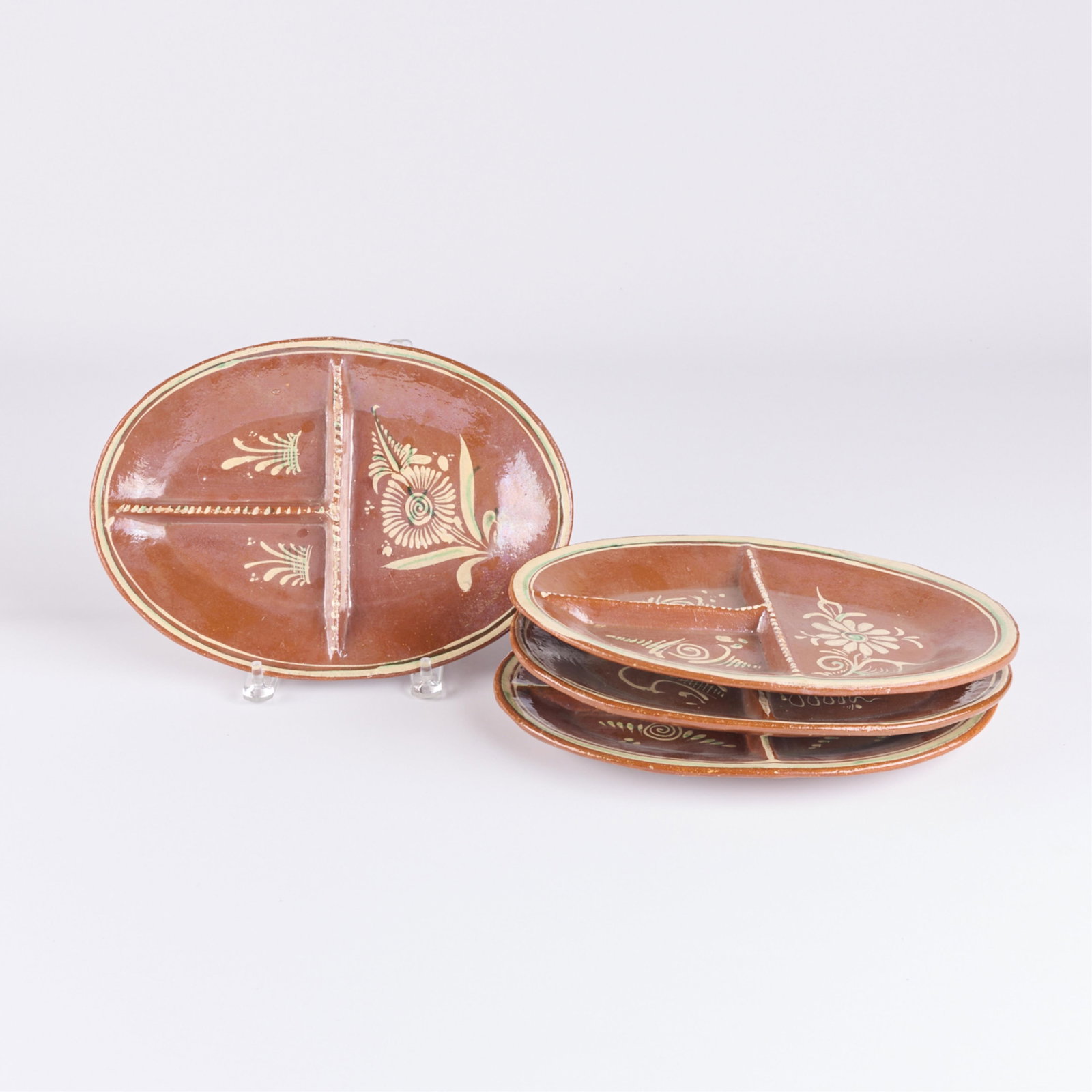 Set 4 Mexican Tlaquepaque Bandera Redware Segmented Oval Dishes: Set of four vintage Mexican folk art "Tlaquepaque" style bandera or red ware tourist pottery divided luncheon oval plates, ca. 1940s-1960s. Each vessel depicting wildlife, foliage, and similar motifs 