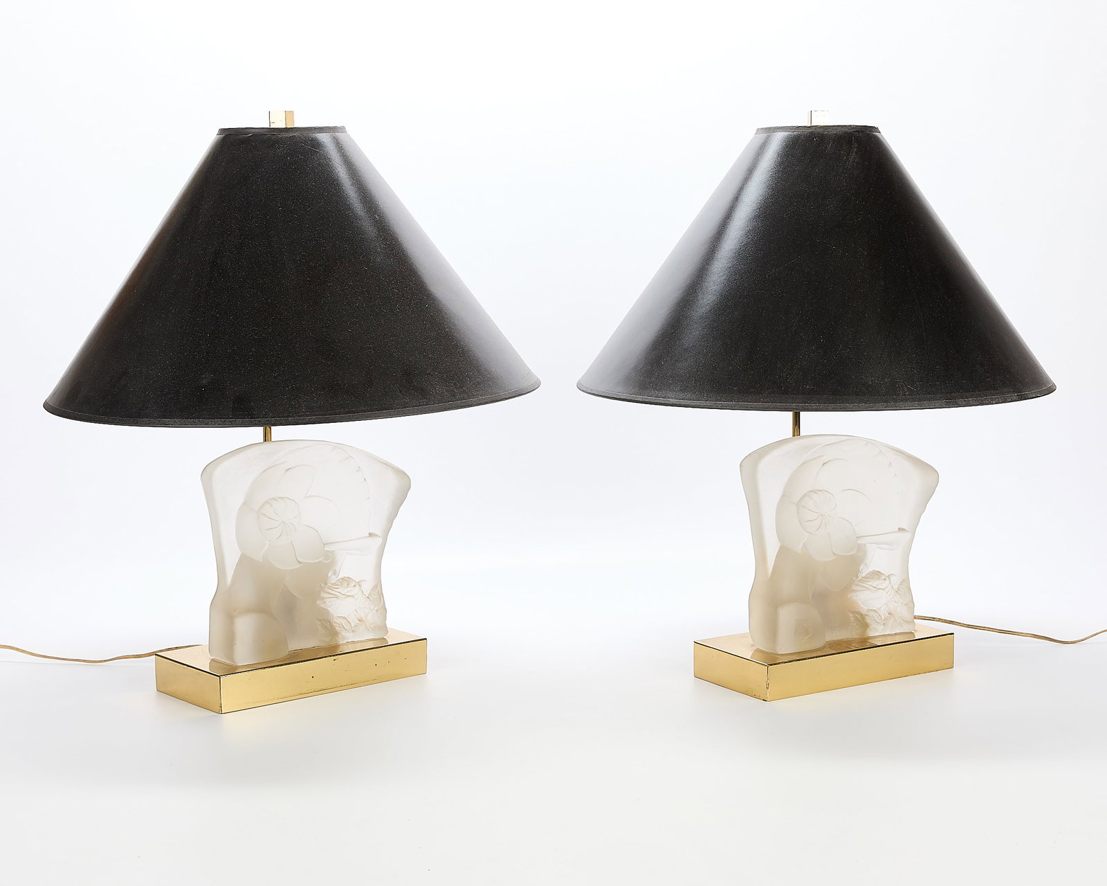 Pair Beth Weissman Lucite Table Lamps: Pair of Beth Weissman lucite table lamps. Each with carved base depicting a young woman holding a rose to her face. (Each) Height: 24 in x diameter: 18 in.