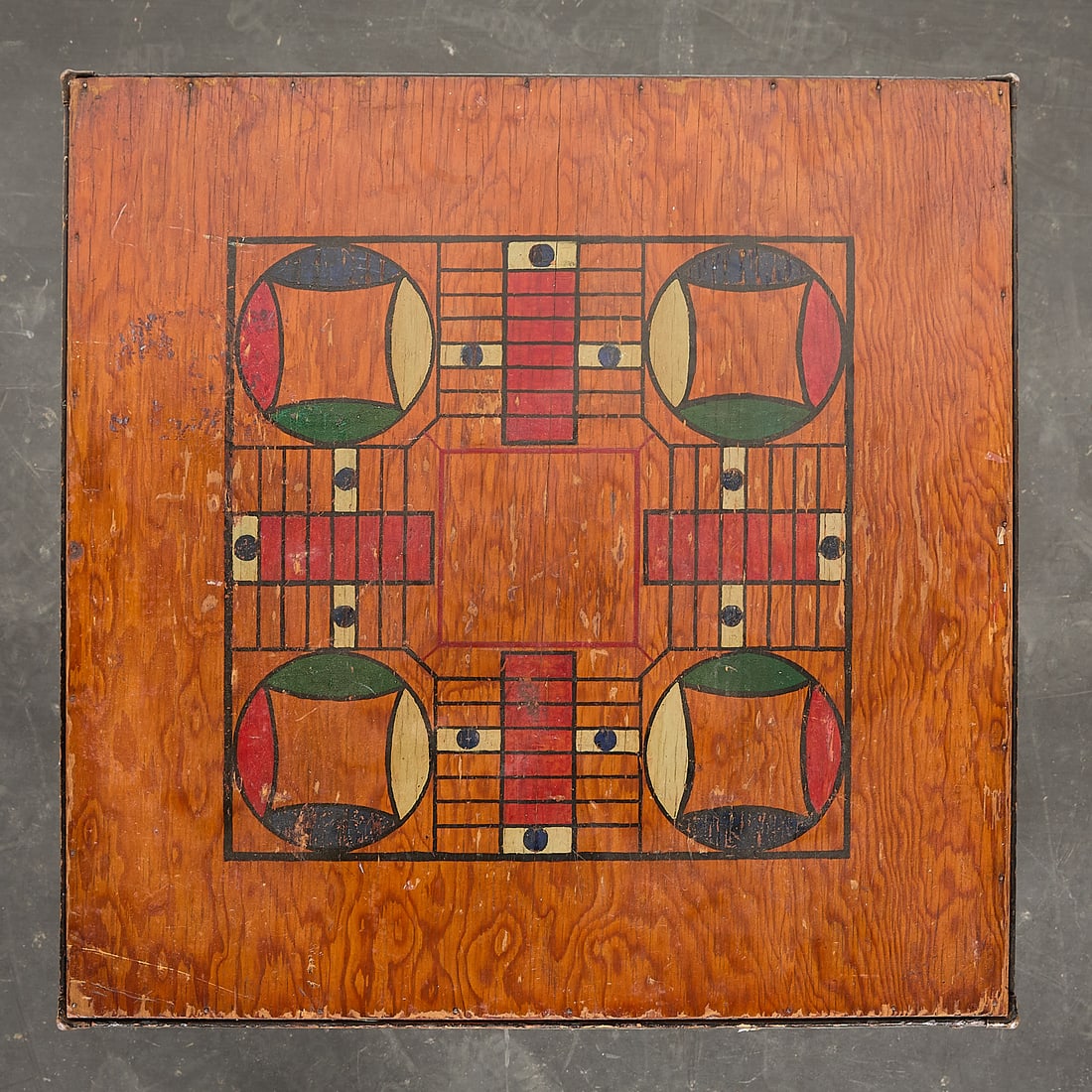 Antique American Folk Art Folding Parcheesi Table: Antique American primitive folk art folding wooden parcheesi game table. Height: 26 in x width: 28 1/2 in x depth: 28 1/2 in.