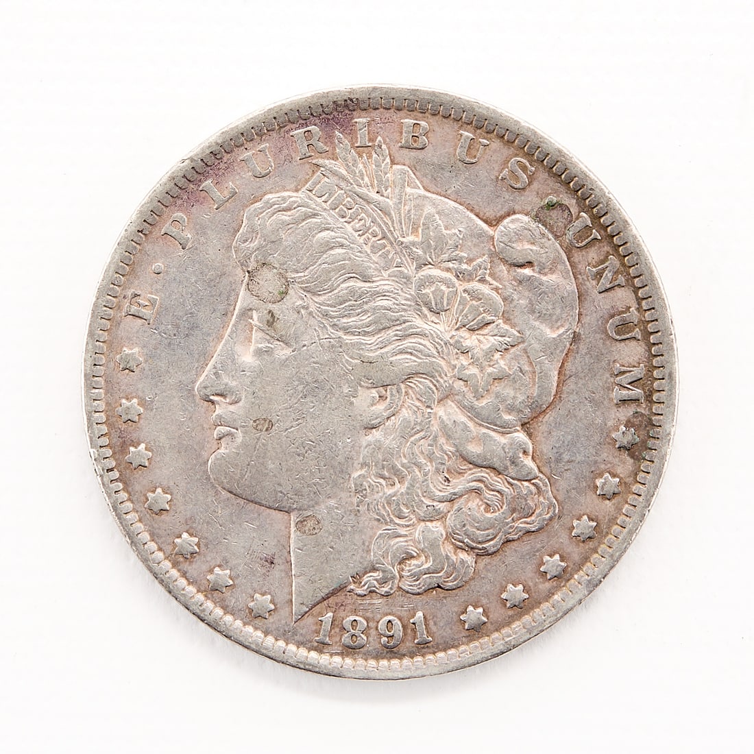 1891-CC Morgan Silver Dollar Coin: 1891-CC Morgan silver dollar coin. Diameter: 38.10 mm. Weight: 26.73 g.