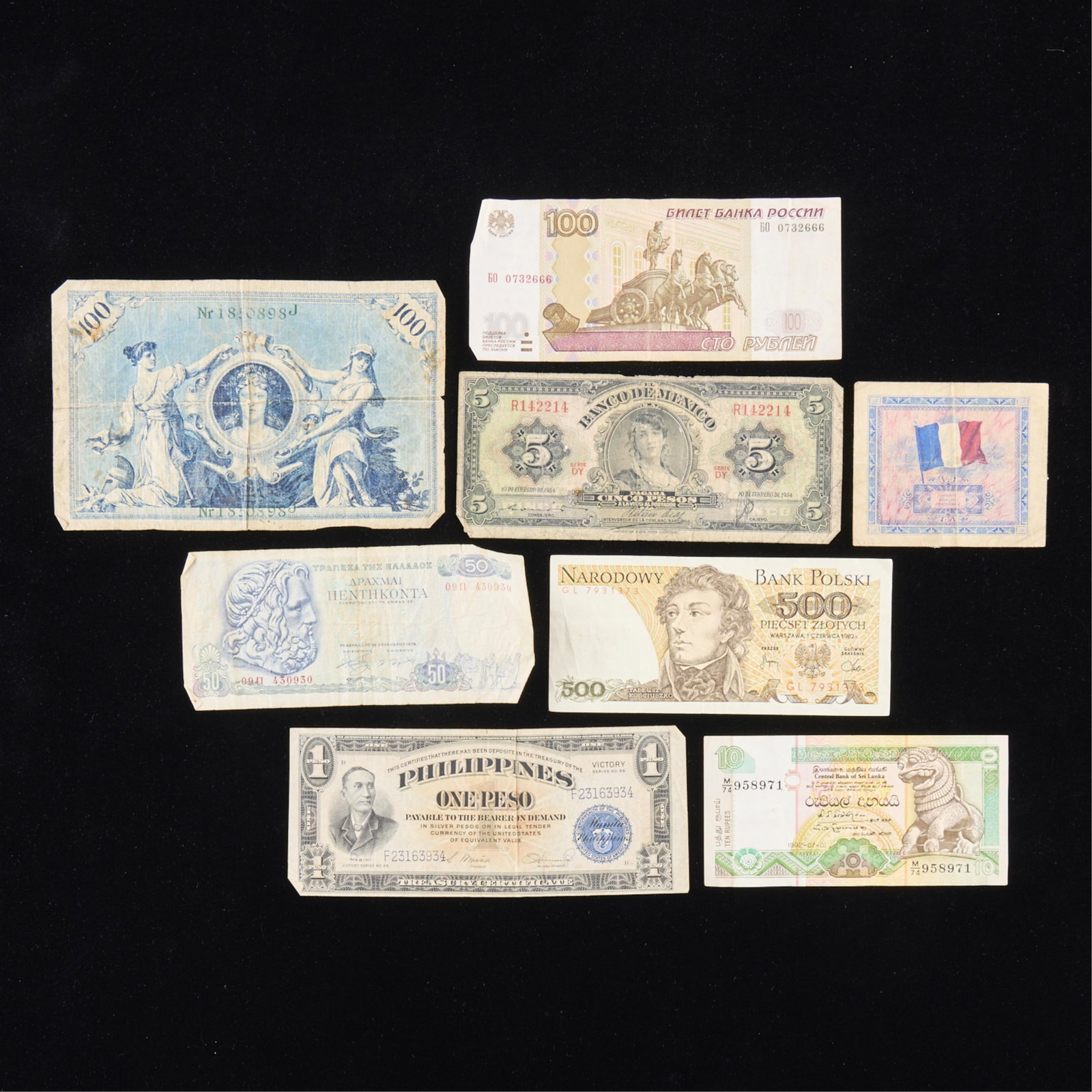 8 Pcs Vintage Foreign Paper Currency: Group of foreign currency including: Russia 100 rubles, 1997; Sri Lanka 10 rupee, 1992; Philippines 1 peso, Victory, series 66; Greek 50 drachma, 1978; Polish 500 zloty, 1982; French 10 francs, 1944;