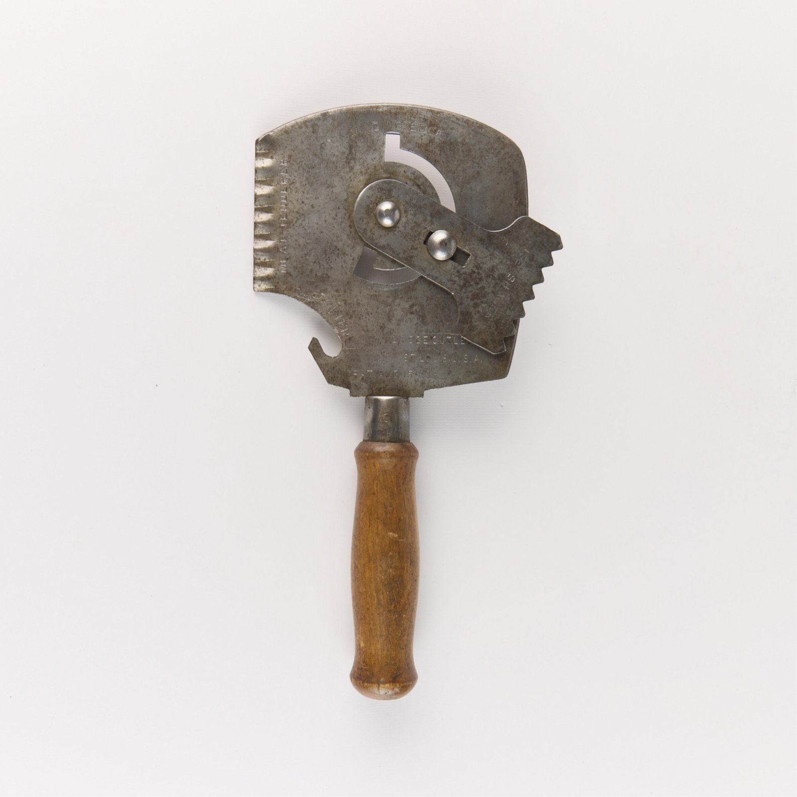Bridge Cutlery "5-In-1" Kitchen Multi Tool 1916: Vintage Bridge Cutlery Company kitchen multi-use tool, 1916. Featuring a bottle opener, meat tenderizer, ice shaver, mincing edge, and cleaver. Marked along the blade. Length: 12 in x width: 5 in.