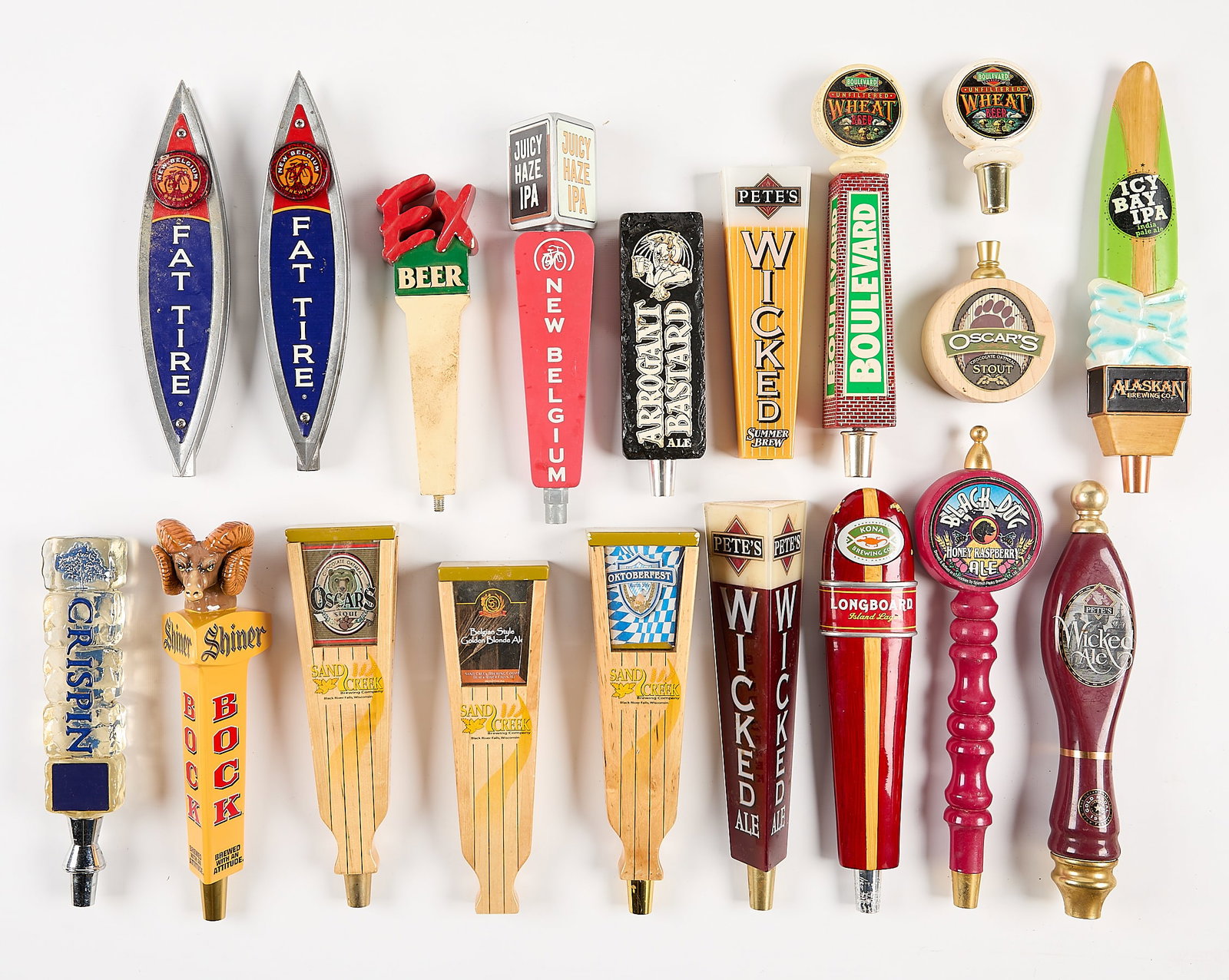 19 American Based Brewing Co. Beer Taps: Group of 19 American based brewing company beer taps including Sand Creek, Crispin, Black Dog, Shiner, and more. (Shipping dimensions) Height: 7 in x width: 14 in x depth: 12 in.