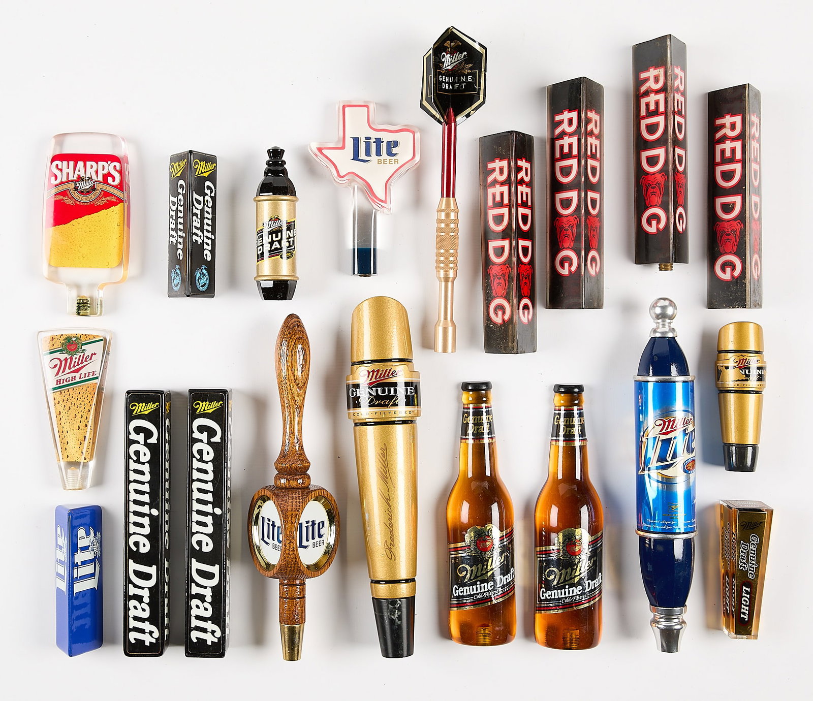 20 Miller Brewing Co. Beer Taps: Group of 20 Miller Brewing Co. (Milwaukee, Wisconsin) beer taps. Including Red Dog, Lite, and Sharps. (Shipping dimensions) Height: 7 in x width: 14 in x depth: 12 in.