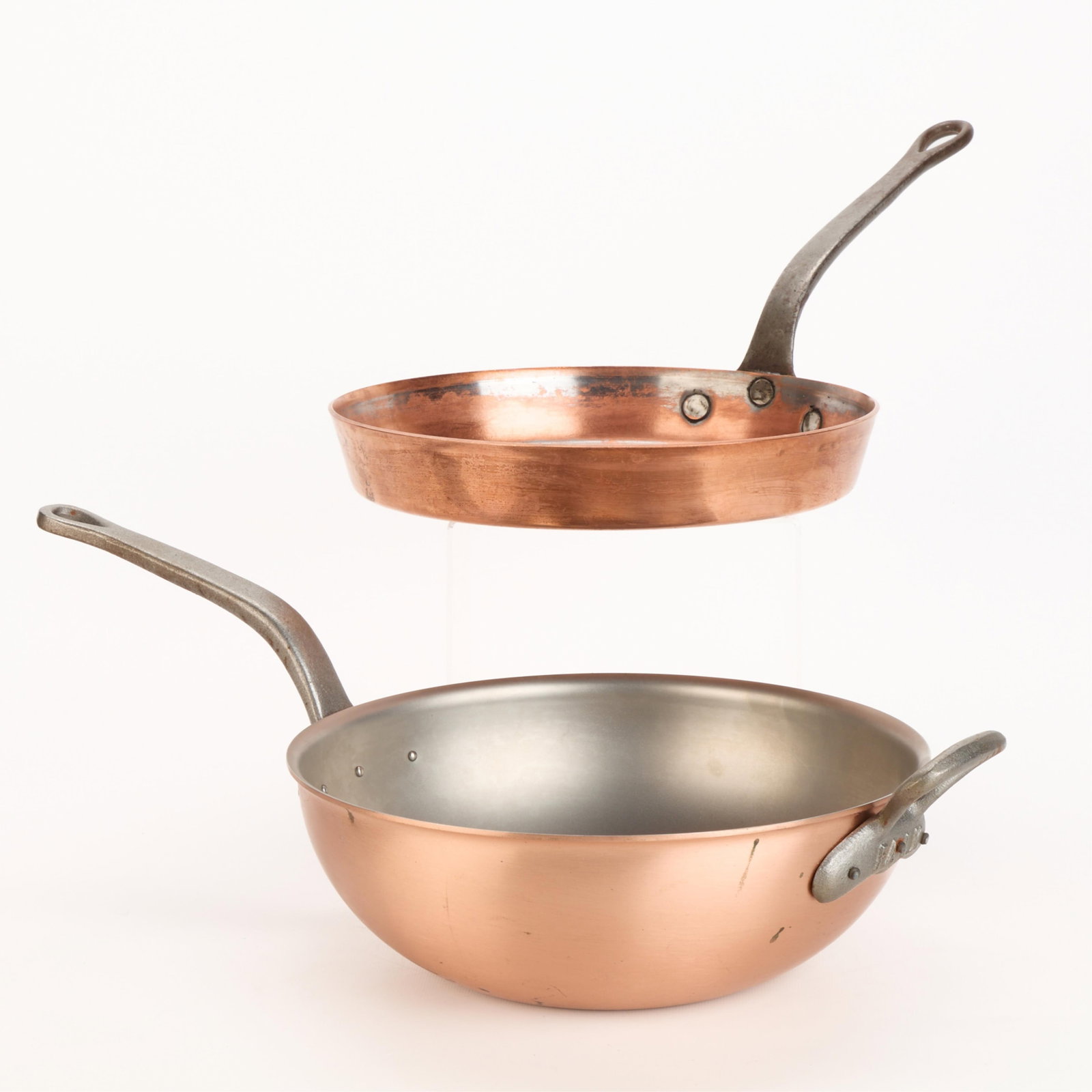 2 Pcs Falk Culinair Copper Cookware: Falk Culinair, Belgium. Group of two copper cookingware pieces. Including a wok, stamped along the underside, and a sauce or saute pan, stamped along the rim. (Wok) Height: 7 1/4 in x width: 20 in x