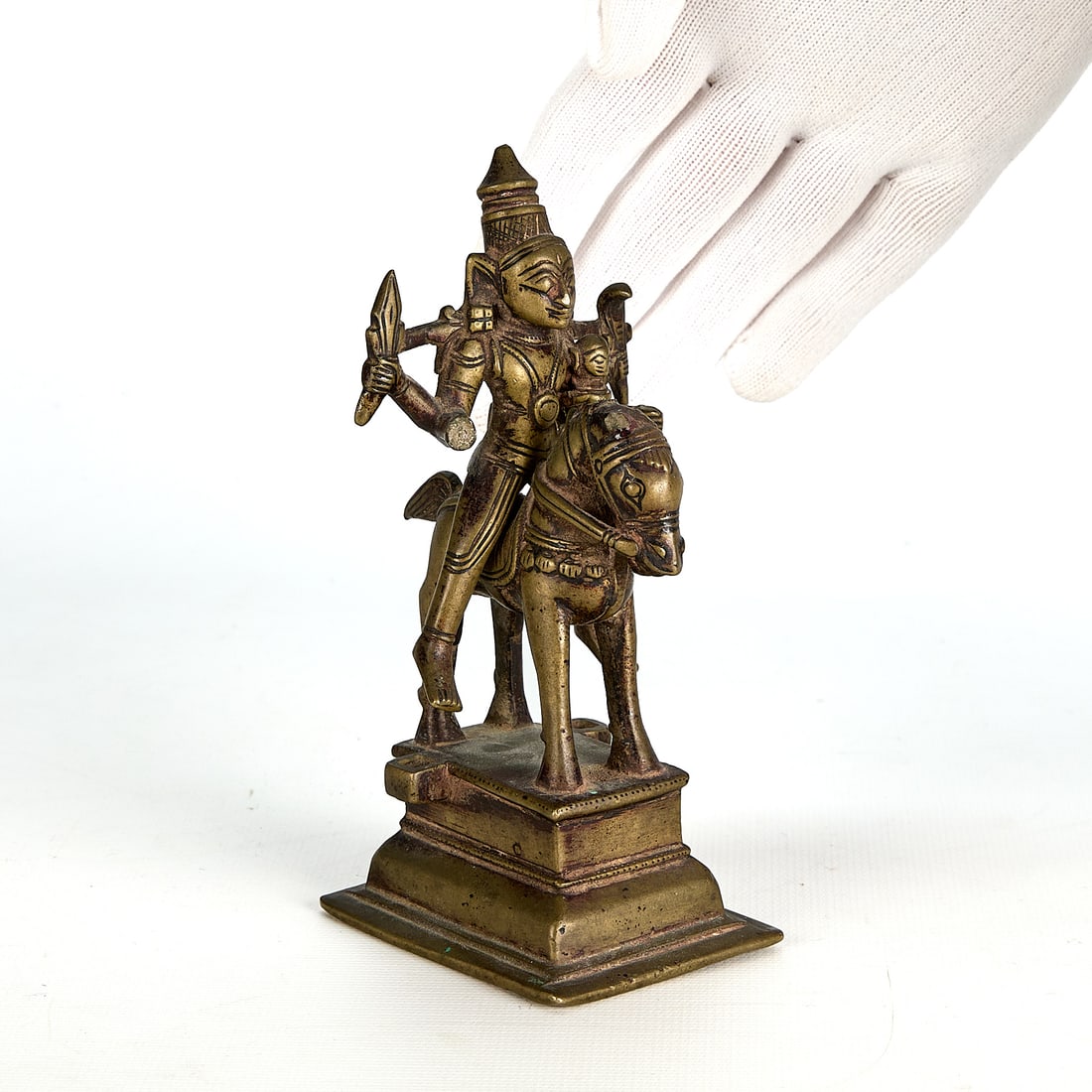 Indian Hindu God Shiva Bronze Figurine: Hindu god Shiva as Khandoba on a horse bronze figurine. Depicting a male figure riding a horse while holding a sword. The figure is designed to detach from the horse. Height: 5 1/2 in x width: 2 in x 