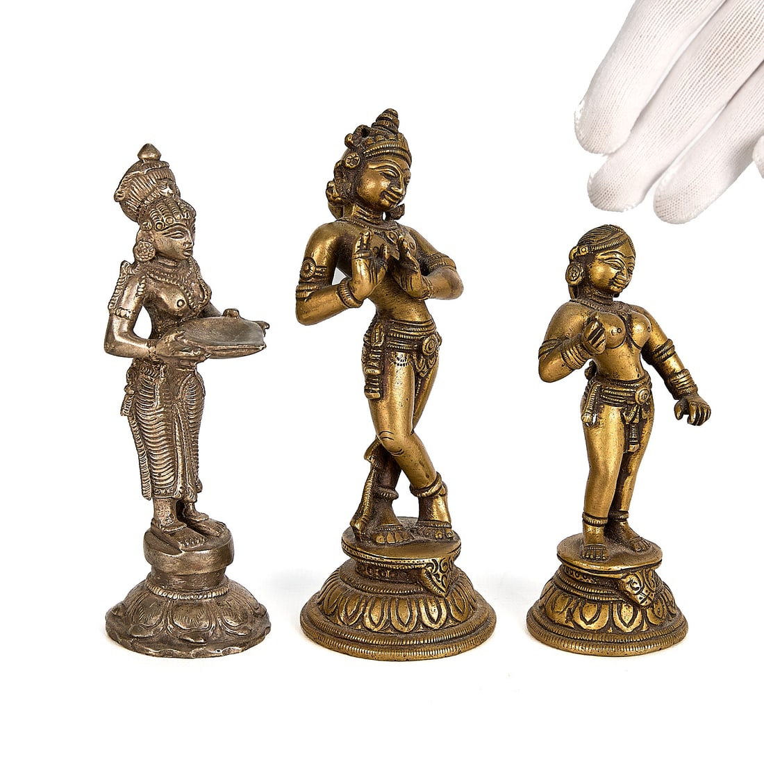 3 Miniature South Indian Bronze Hindu Deity Figures: Group of three minature South Indian bronze figures depicting Hindu deities. Height ranges from 4 1/2 in to 5 3/4 in; width ranges from 1 3/4 in to 2 3/4 in; depth ranges from 1 1/2 in to 2 1/4 in. Gr
