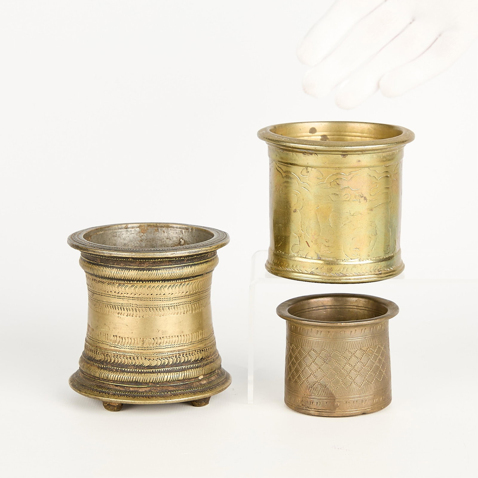 3 Indian Gilt Bronze Panchapatra Vessels: Group of three Indian or Southeast Asian gilt bronze Hindu panchapatra ritual cups or ceremonial vessels. Height ranges from 2 in to 3 1/2 in; diameter ranges from 2 1/2 in to 3 1/2 in. Gross weight: 