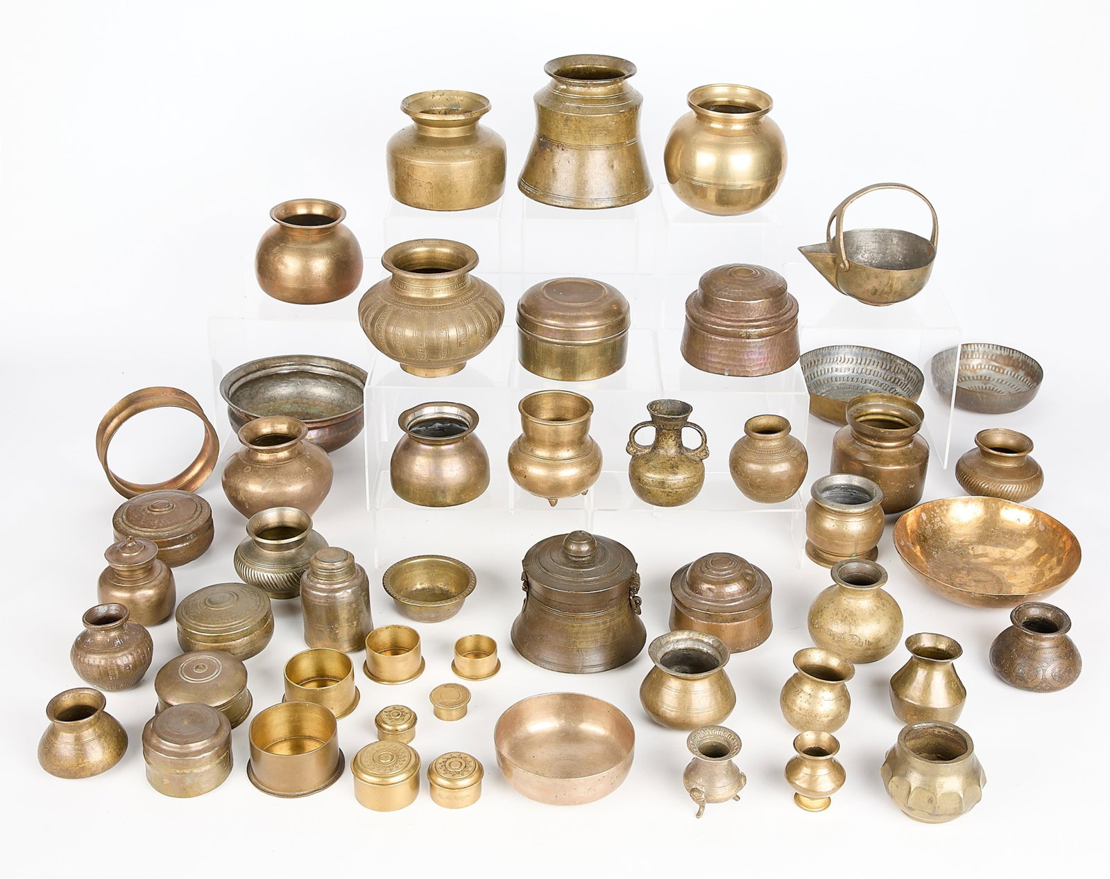 44 Indian & SE Asian Bronze & Brass Vessels 31 lbs: Group of 44 Indian and Southeast Asian bronze and brass vessels. (Shipping dimensions) height: 12 in x width: 14 in x depth: 22 in. Weight: 31 lbs 14 oz.