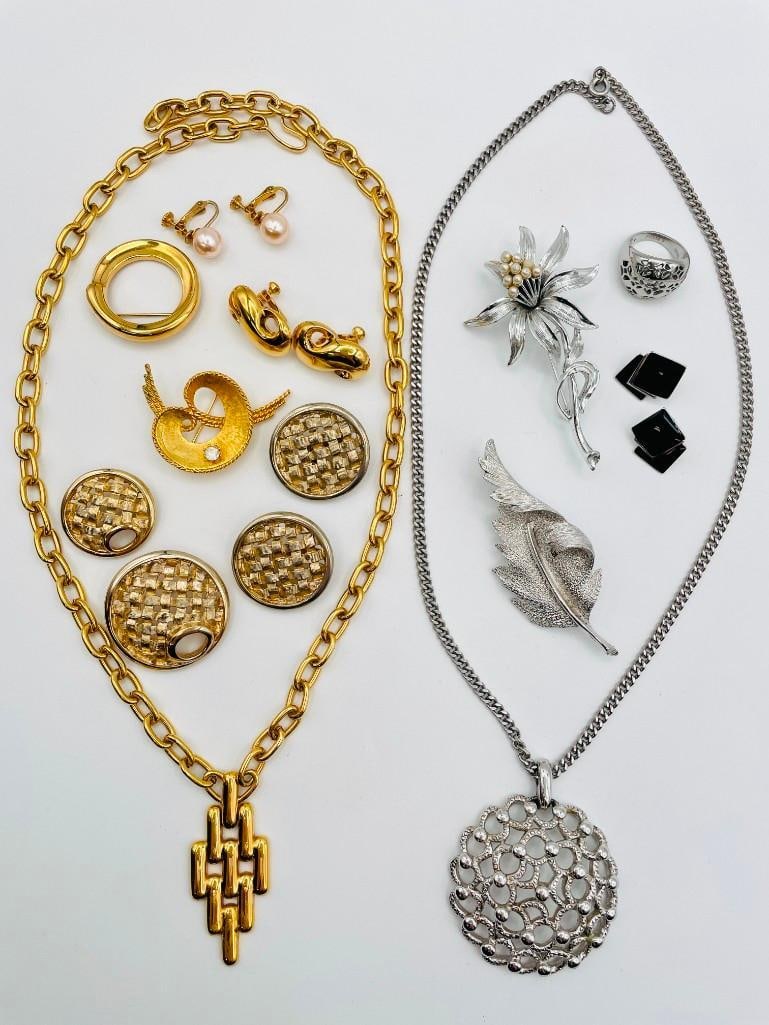 Costume Jewelry Trifari, Coro, Monet, Napier, Sarah Cov: Gold-tone Jewelry: Monet Pendant, 24 inches long; Monet Brooch; Napier Clip-on Earrings; Mamselle Brooch with Rhinestone; Sarah Coventry Basketweave Clip-on Earrings and Two Brooches; Faux Pearl Clip-