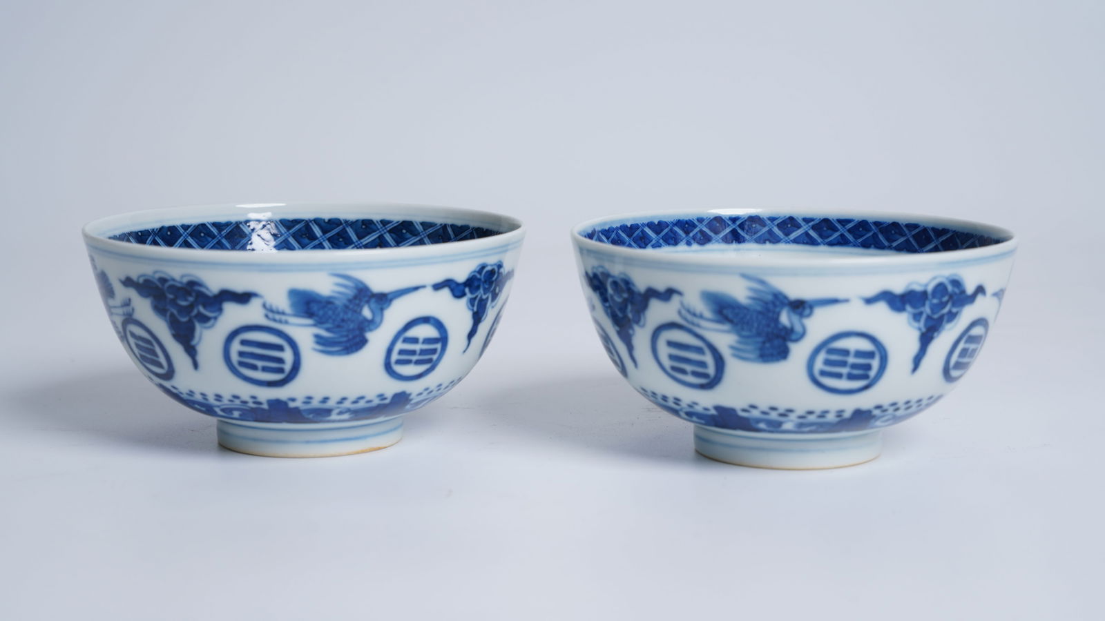 Three Chinese porcelain blue and white moon flasks: Two Chinese porcelain blue and white moon flasks, 19th C. Height:34cm