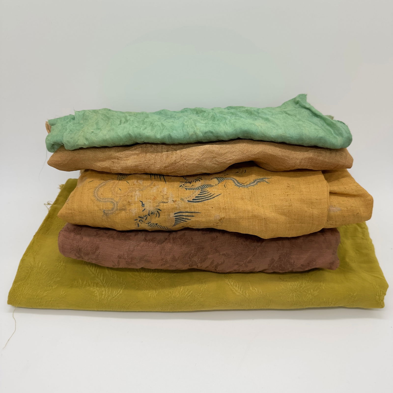 A ground of chinese silk items (1 of 3)