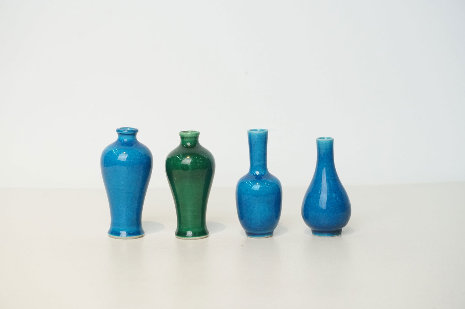 A lot of 4 monochrome turquoise and aubergine Chinese porcelain vases (1 of 1)