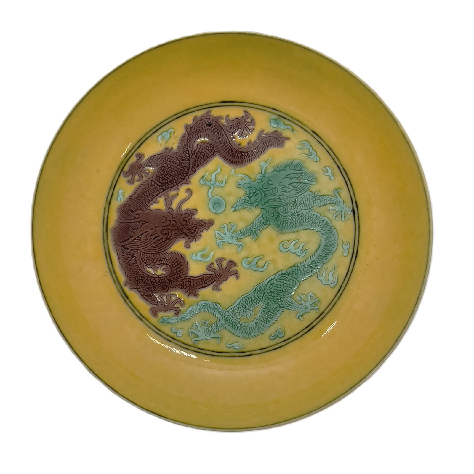 Yellow Ground Dragon Motif Dish: A striking antique Chinese dish with a rich imperial yellow ground, featuring a central medallion depicting two finely molded or incised dragons in contrasting colors (one brown, one green/blue) chasi