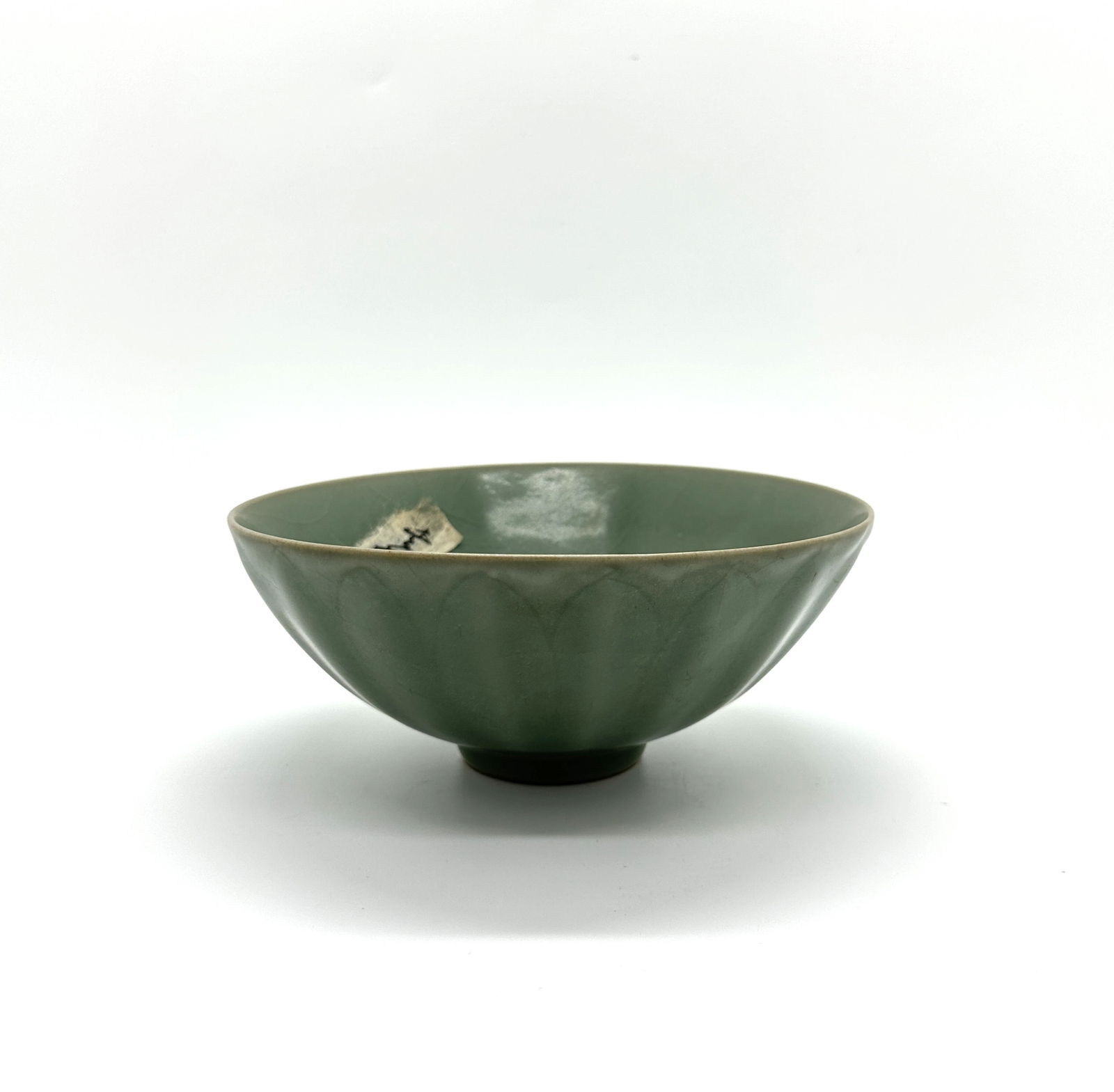 CHINESE SONG CELADON BOWL: CHINESE SONG CELADON BOWL of fluted conical form, raised on a tall circular foot.Diameter:6.88''(17.5cm) Height :2.95''(7.5cm)