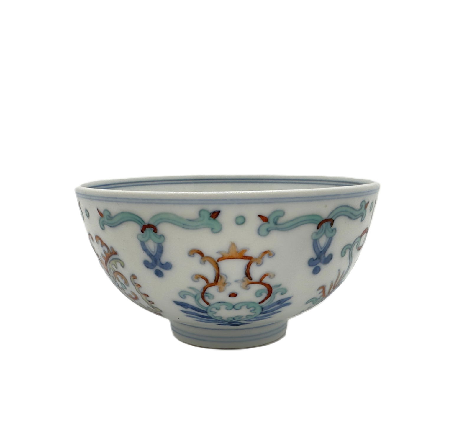 A ChinesePolychrome Floral and Scrollwork Bowl: An antique Chinese bowl decorated with a colorful array of stylized floral and scrollwork motifs in various enamels, including blue, orange, and green, against a white ground. Diameter:4.13''(10.5 cm)