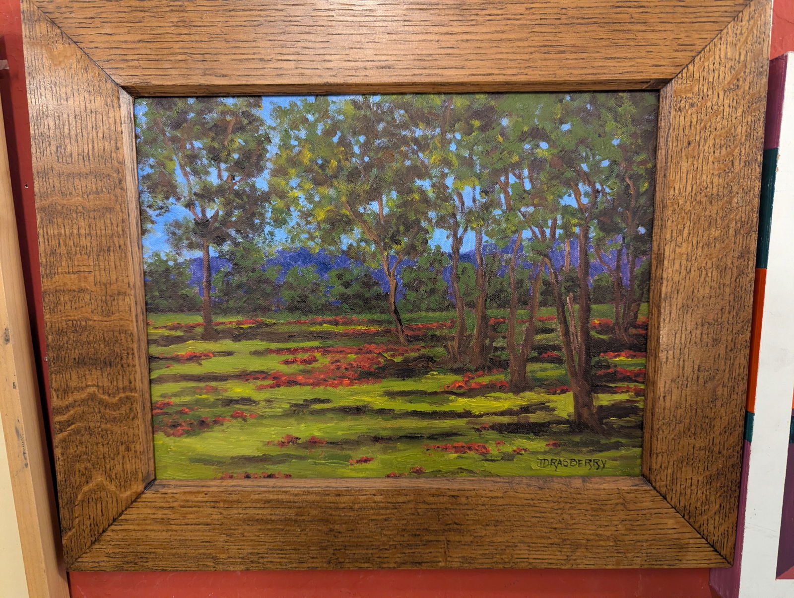 A signed oil painting with trees and mountain.: A signed oil painting with trees and mountain.12'x16"