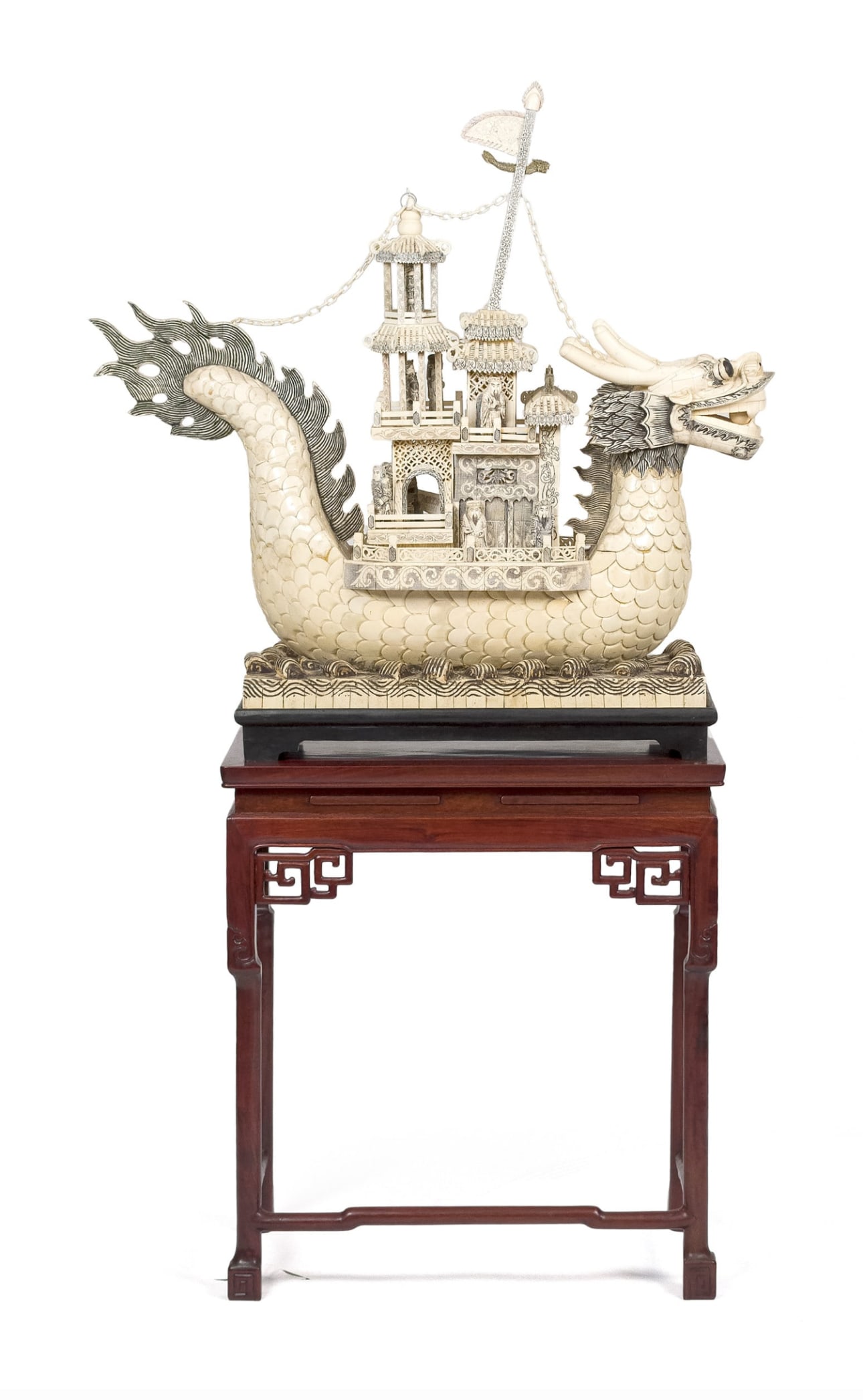 MONUMENTAL CARVED CHINESE BONE DRAGON BOAT.19th.C: A 19th C. large scale carved bone Chinese dragon form boat, with finely carved details. Includes a separate rosewood stand and another black painted base for display. Boat 30”H x 33”W x 10