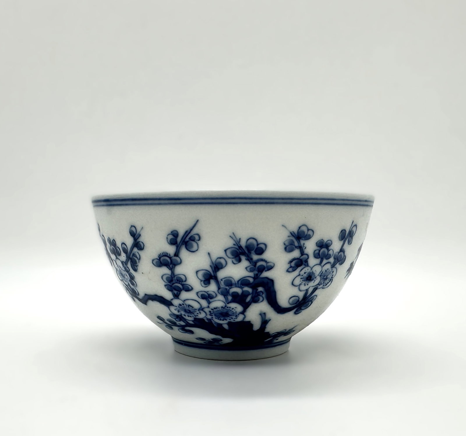 A Chinese Blue and White 'Three Friends of Winter' Bowl,19th.C: This is an elegant porcelain bowl from the Guangxu reign (1875–1908) of the Qing Dynasty, decorated in the classic underglaze blue technique.Diam. 3.74 in, Ht. 2.17 in