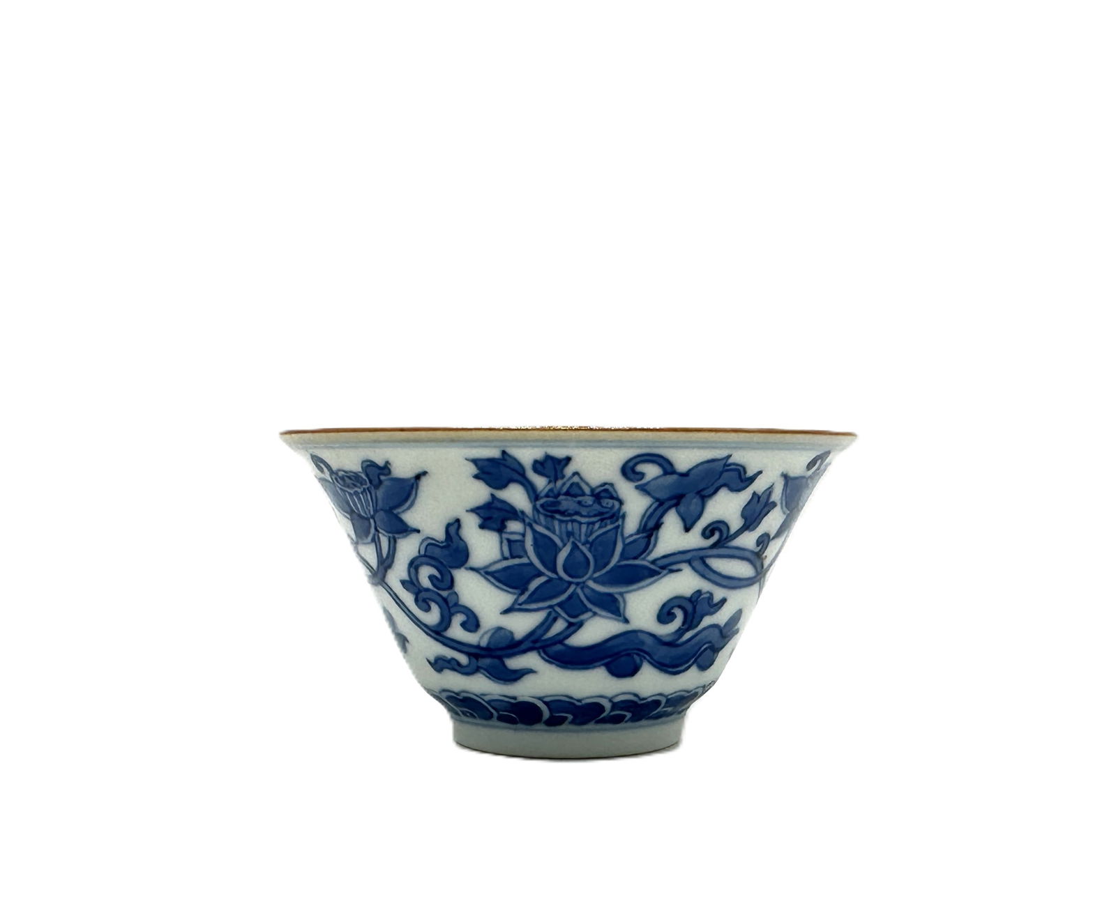 A Chinese Blue and White Lotus Scroll Bowl: This is a fine porcelain bowl,The exterior is richly decorated with continuous scrolling lotus flowers and leaves, a symbol of purity and enlightenment in Chinese culture. The interior features a smal