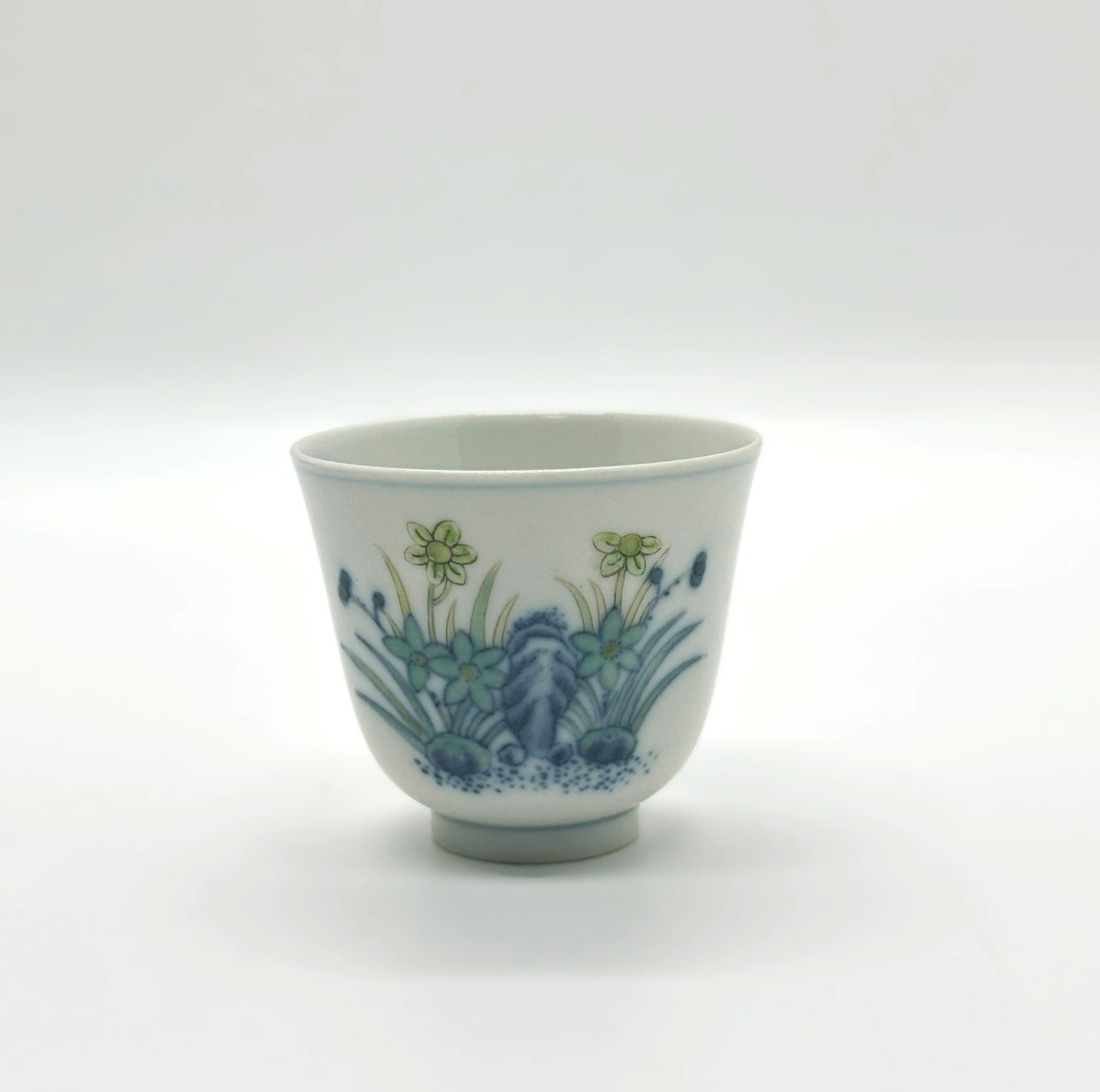 Qing Dynasty Tongzhi Period Doucai Floral Teacup.China: The base bears a six-character reign mark in underglaze blue: "Da Qing Tongzhi Nian Zhi" , confirming its origin. The cup’s thin, translucent porcelain and subtle palette exemplify the refined taste