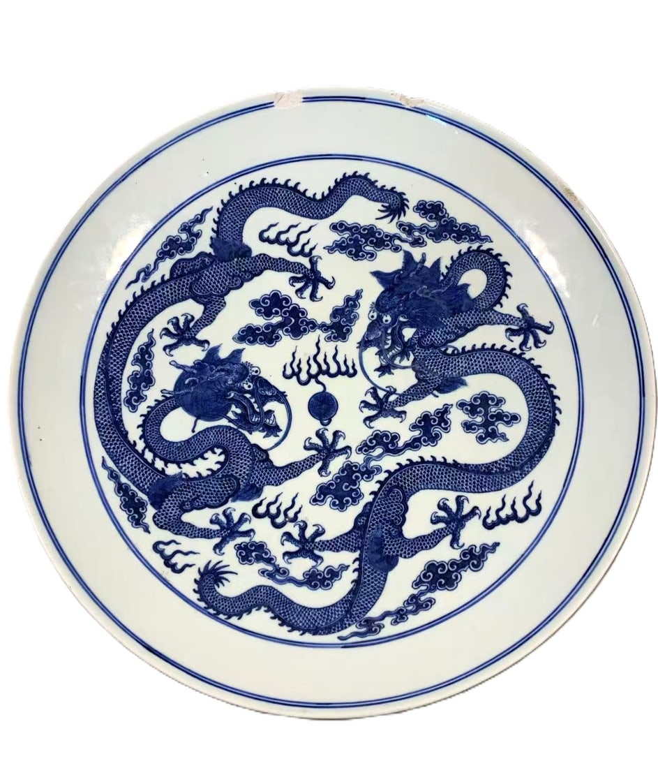 Qing Dynasty Guangxu Period Blue and White 'Two Dragons Chasing the Pearl' Large Charger19th.C: This magnificent large charger dates to the Guangxu reign (1875–1908) of the late Qing Dynasty, a period known for its revival of grand imperial porcelain. It is decorated in the classic underglaze