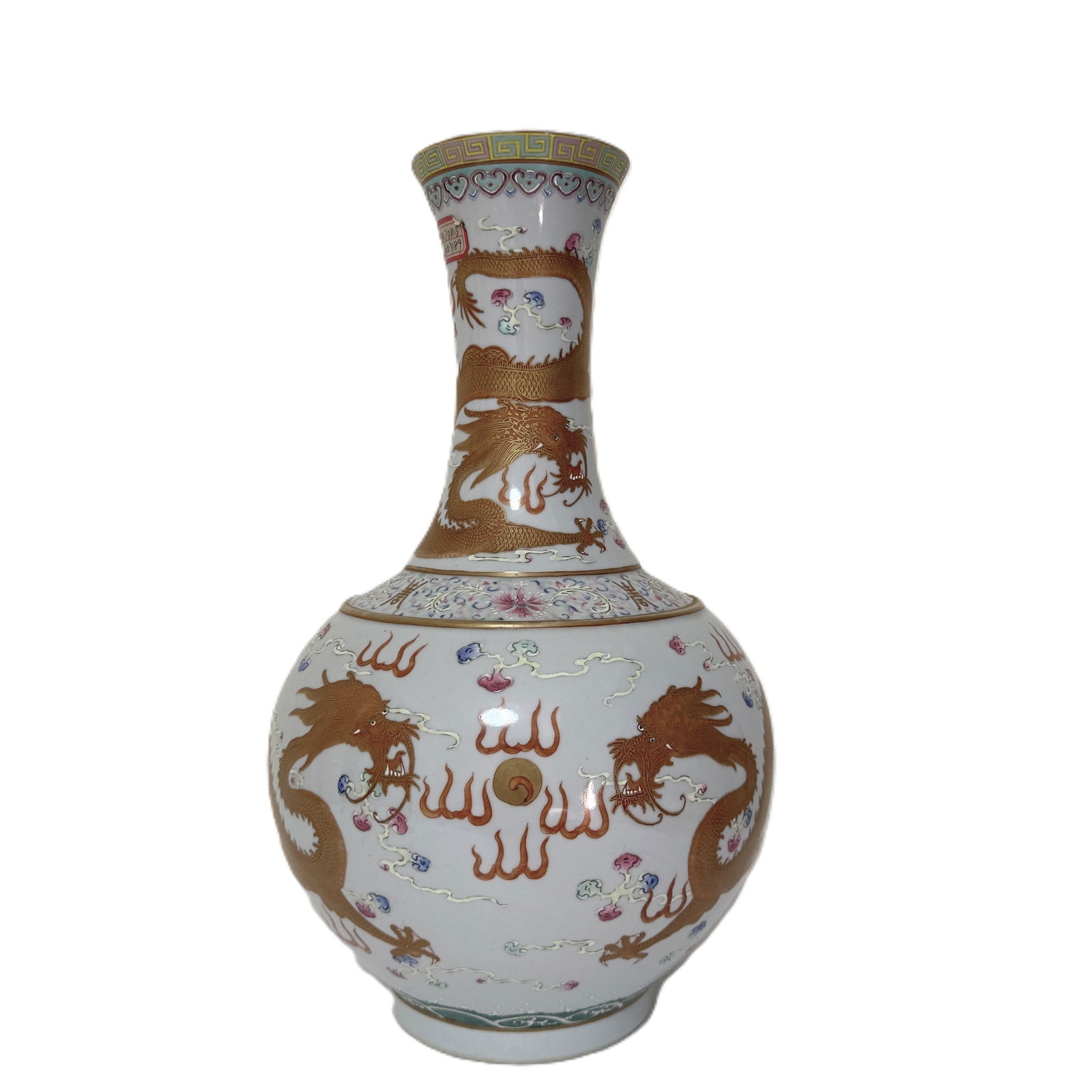 A Chinese famille rose 'dragon' bottle vase: A bottle vase decorated with Buddhist emblems and golden dragons chasing the flaming pearl among clouds. Six character red Guangxu mark at the base. China, 19th century. Height:39.5cm