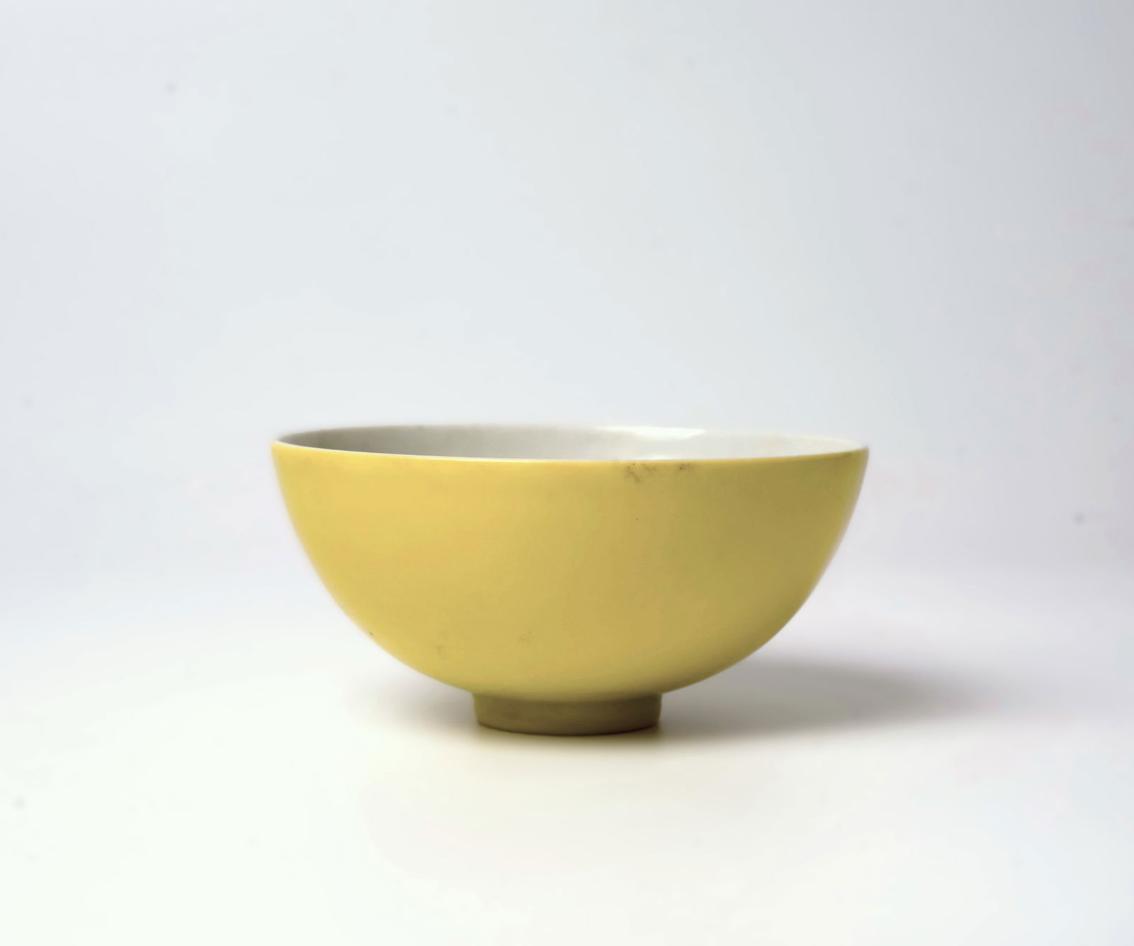 A Chinese Yellow-glazed Bowl, 20th Century: A Chinese monochrome yellow bowl, Yongzheng mark, 20th C.Diameter: 3 3/4''(9.5 cm)