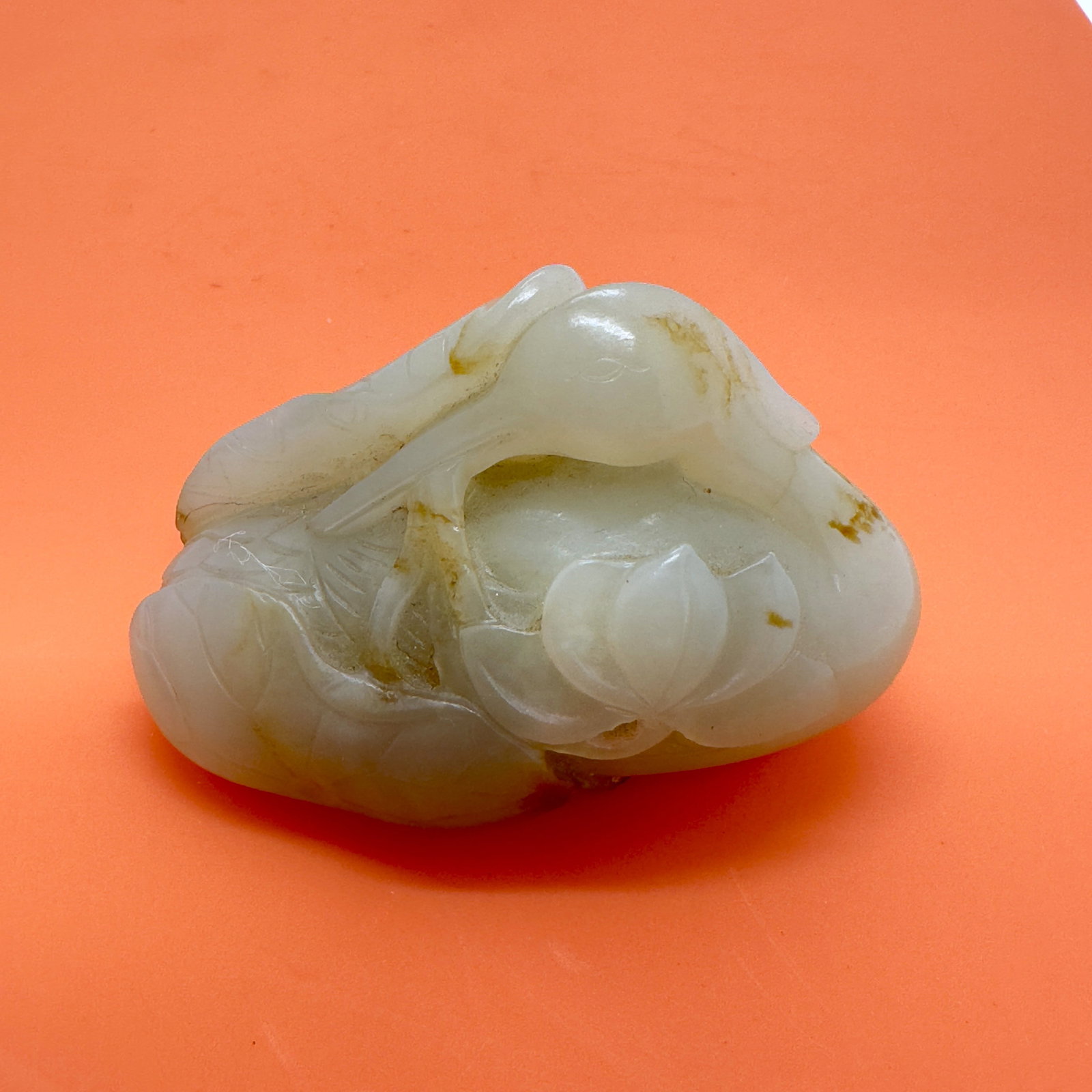 Chinese White Jade Goose Carving,18th.C: This is an early 18th ? century white jade carving of a goose with lotus, crafted in the Early Qing style. Carved in high relief from fine white jade with natural russet inclusions, the piece depicts