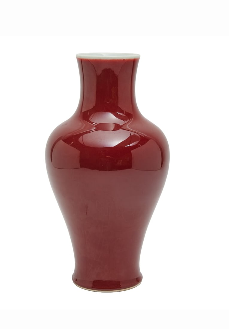 A Chinese Oxblood Porcelain Baluster Vase: A Chinese Oxblood Porcelain Baluster Vase.{Height 13 1/2 inches (34.3cm)}.