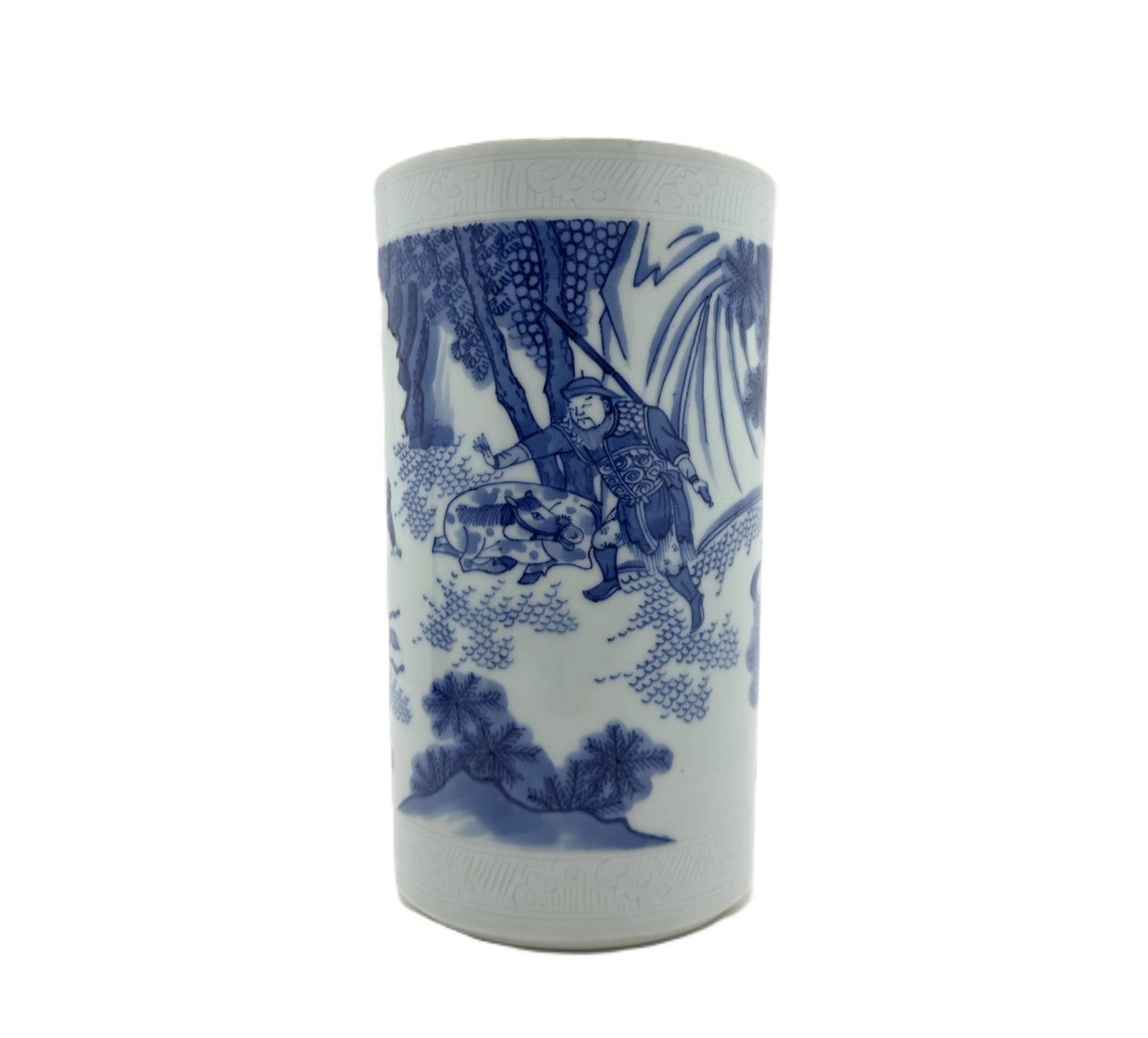 Blue and White Figure and Animal Brush Pot: An antique Chinese cylindrical brush pot decorated in classic blue and white, depicting a narrative scene with a warrior or hunter figure and an animal, possibly a boar, beneath trees.Height :7.4''(18