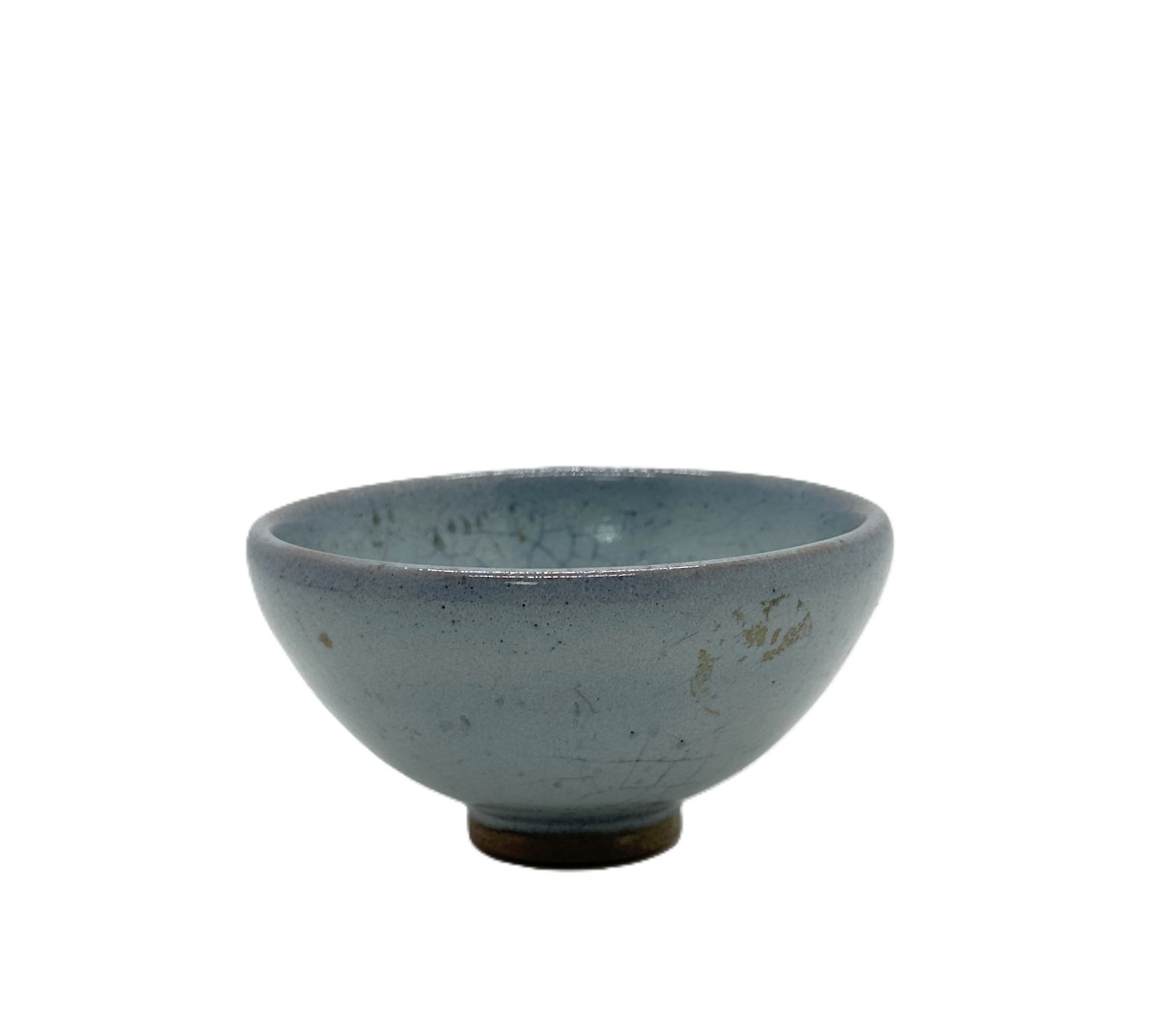 A small bowl of Chinese Junyao: Diameter: 3.75''(9.5 cm), Height: 2''(5 cm)Cone-shaped tea bowl covered in pale sky-blue Jun glaze with natural fine crackle lines and scattered tiny dark speckles; exterior bears minor aged golden we
