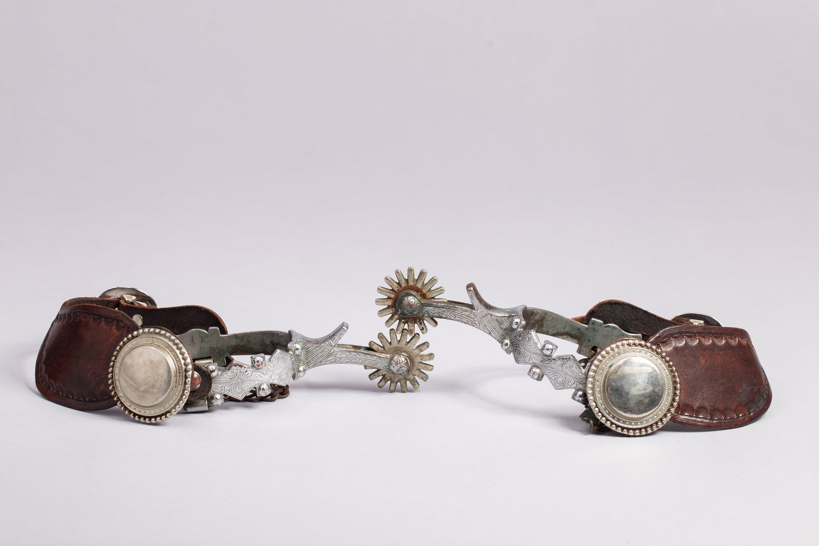 California Spurs, Early & Unmarked, Diamond Pattern: California Spurs, Early & Unmarked, midcentury, Double Diamond Pattern Pitman parade style. Fitted with heel chains, Provenance: George Pitman Collection.
