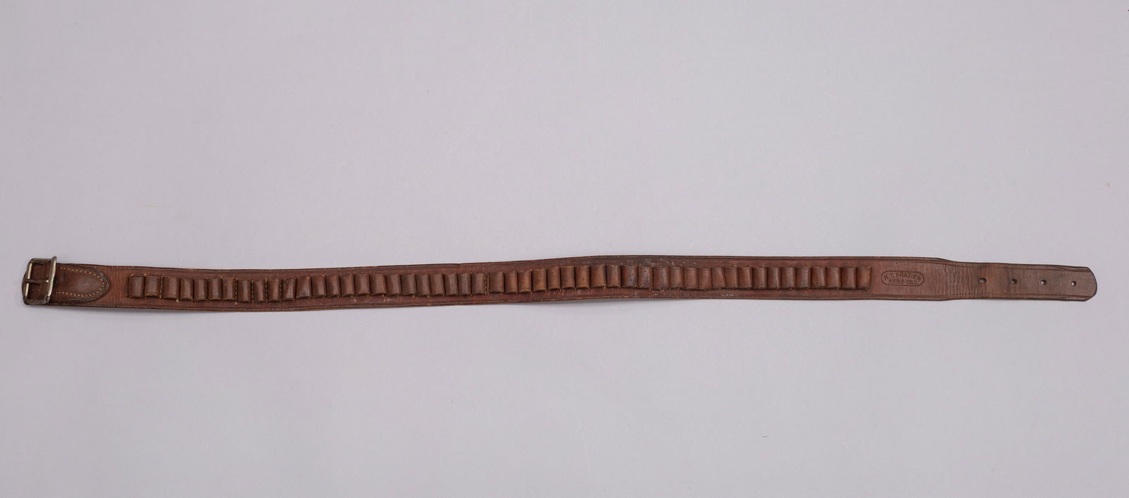 R.T. Frazer Thimble Belt: Marked "R.T. Frazier, Pueblo-COLO" belt, holds 50 bullets. Measurements: 36 1/2"L x 1 1/2"W