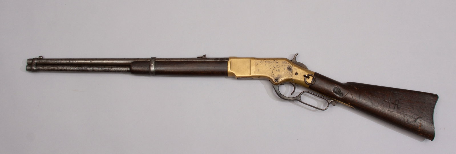 Winchester Model 1866 Saddle Ring Carbine Antique Rifle with Factory Letter: American Indian gun with marking on butt stock reflecting carving of a tepee, burn mark and other carved symbols and carved "JAT" in forearm. Expert's comment on rifle "It's marked Hunkpapa Sioux. It 